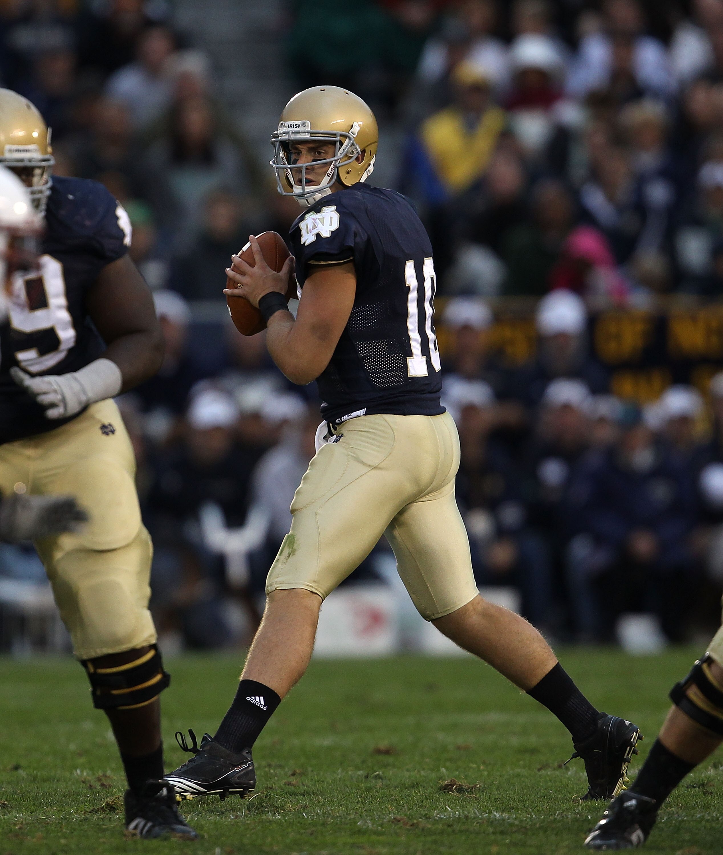 SOUTH BEND, IN - SEPTEMBER 25: Dayne Crist #10 of the Notre Dame Fighting Irish looks for a receiver against the Stanford Cardinal at Notre Dame Stadium on September 25, 2010 in South Bend, Indiana. Stanford defated Notre Dame 37-14. (Photo by Jonathan Da