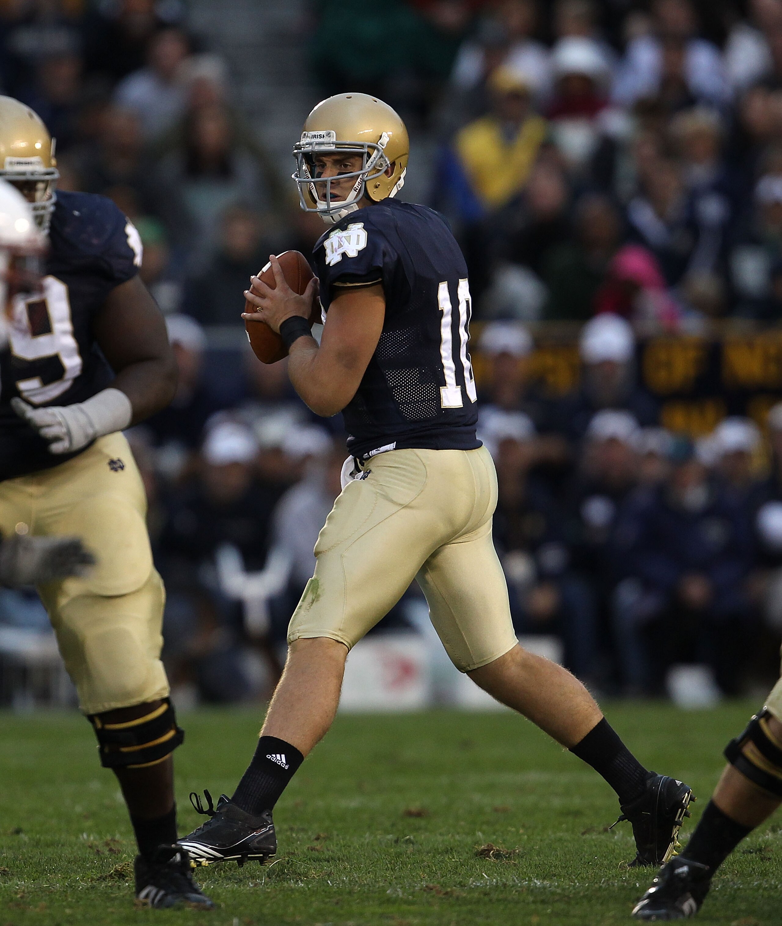 SOUTH BEND, IN - SEPTEMBER 25: Dayne Crist #10 of the Notre Dame Fighting Irish looks for a receiver against the Stanford Cardinal at Notre Dame Stadium on September 25, 2010 in South Bend, Indiana. Stanford defated Notre Dame 37-14. (Photo by Jonathan Da