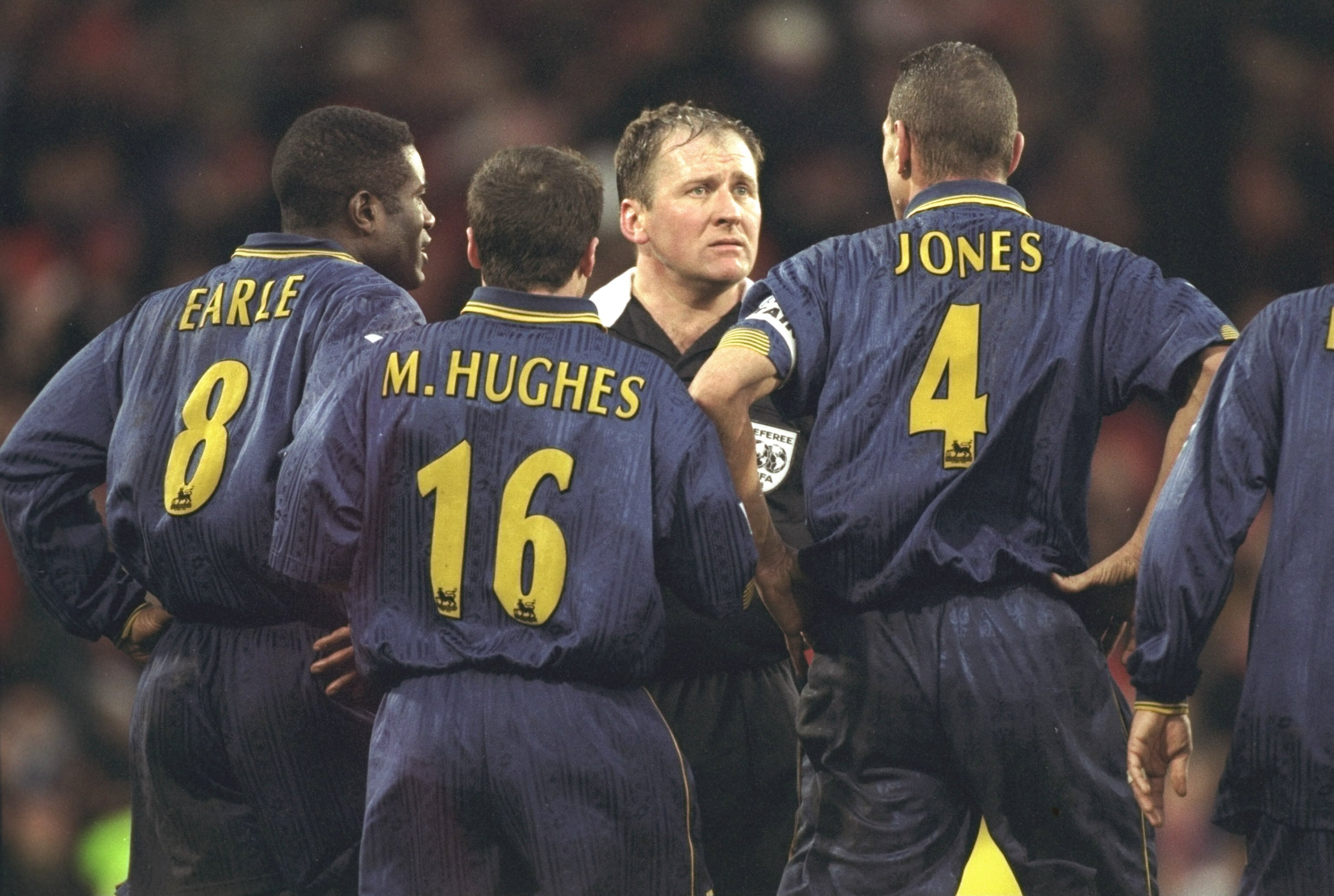 4 Jan 1998:  (left to right) Robbie Earle, Michael Hughes and Vinny Jones of Wimbledon confront the referee, Steve Dunn, after having a goal disallowed due to the whistle going for full time during the FA Cup third round tie against Wrexham at Selhurst Pa