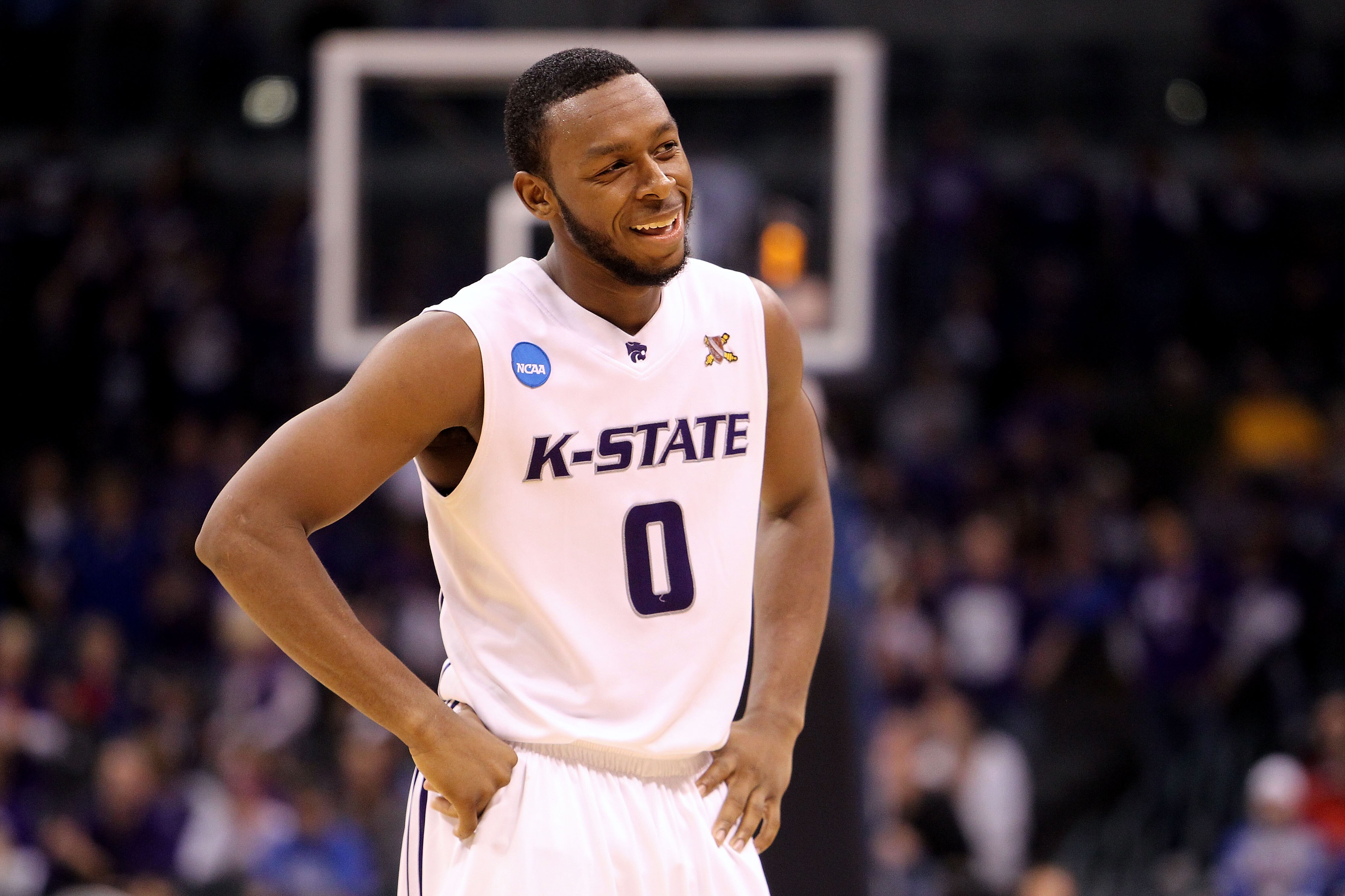 OKLAHOMA CITY - MARCH 20:  Jacob Pullen #0 of the Kansas State Wildcats smiles on court against the Brigham Young Cougars during the second round of the 2010 NCAA men's basketball tournament at Ford Center on March 20, 2010 in Oklahoma City, Oklahoma.  (P