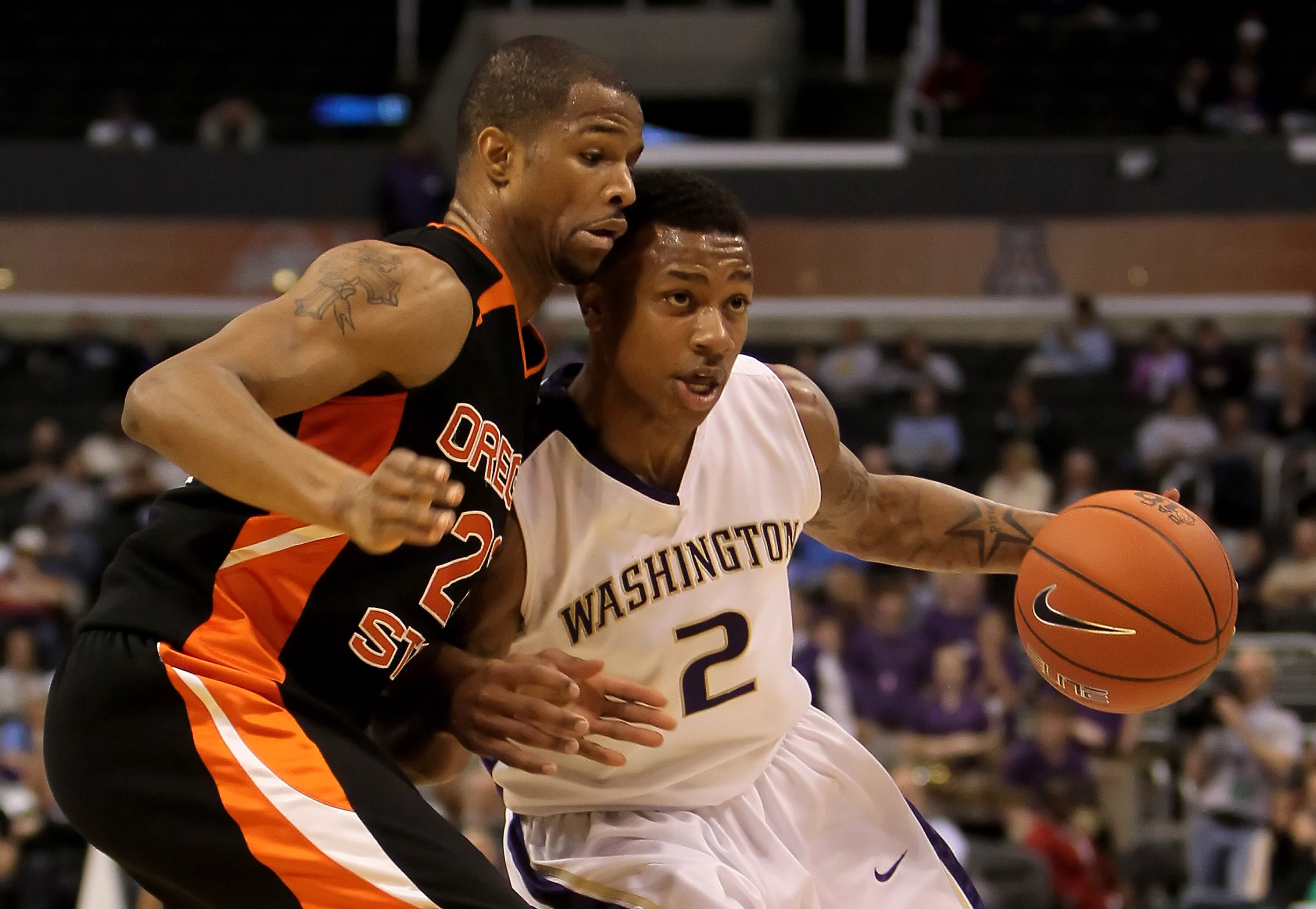 LOS ANGELES, CA - MARCH 11:  Isaiah Thomas #2 of the Washington Huskies is defended by Calvin Haynes #22 of the Oregon State Beavers in the first half during the Quarterfinals of the Pac-10 Basketball Tournament at Staples Center on March 11, 2010 in Los