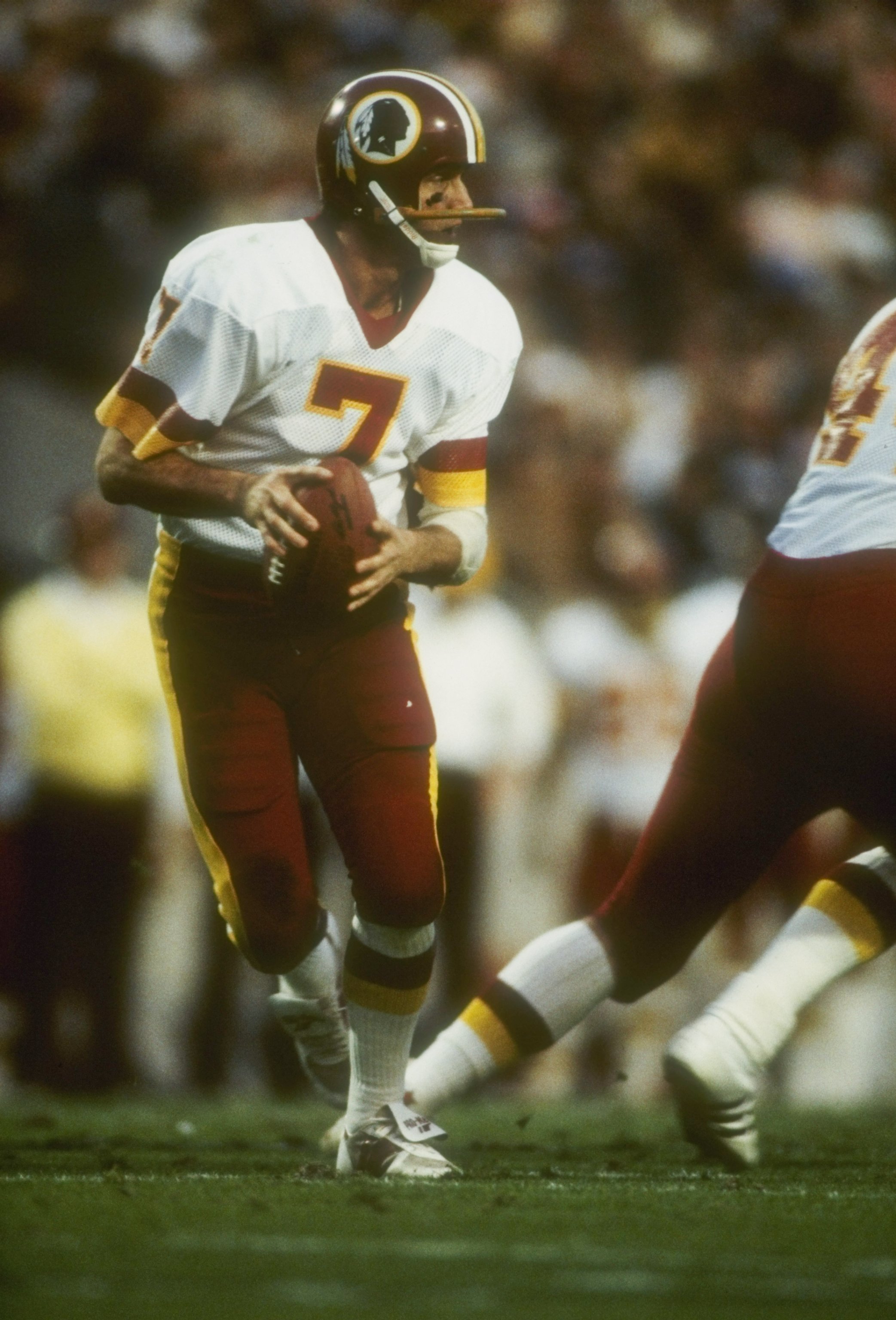 22  Jan 1984:   Quarterback Joe Theismann #7 of the Washington Redskins looks to pass during Super Bowl XVIII against the Los Angeles Raiders at Tampa Stadium in Tampa, Florida. The Raiders won the game 38-9. Mandatory Credit: Allsport  /Allsport