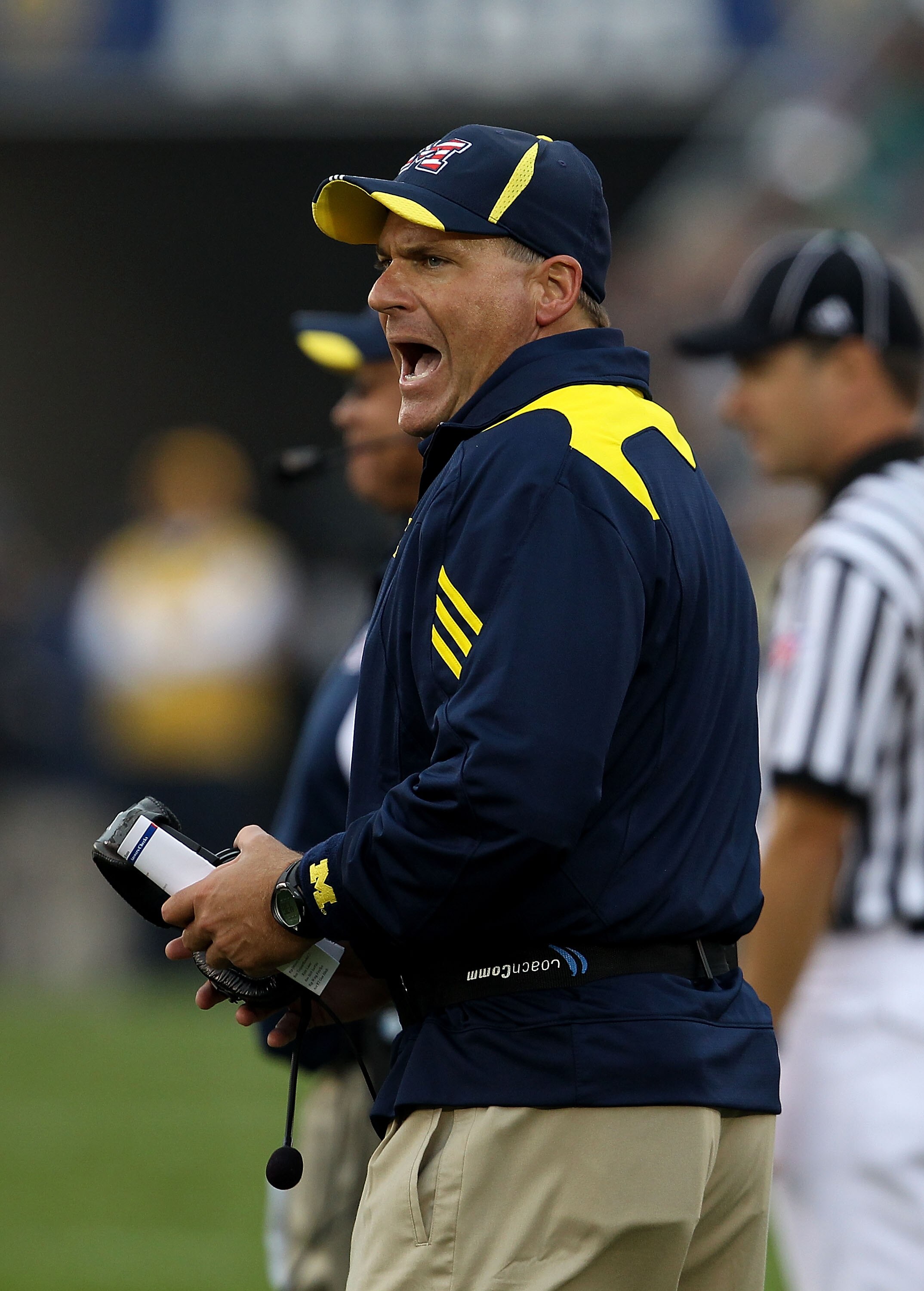 SOUTH BEND, IN - SEPTEMBER 11: Head coach Rich Rodriguez of the Michigan Wolverines yells at an assistant coach during a game against the Notre Dame Fighting Irish at Notre Dame Stadium on September 11, 2010 in South Bend, Indiana. Michigan defeated Notre