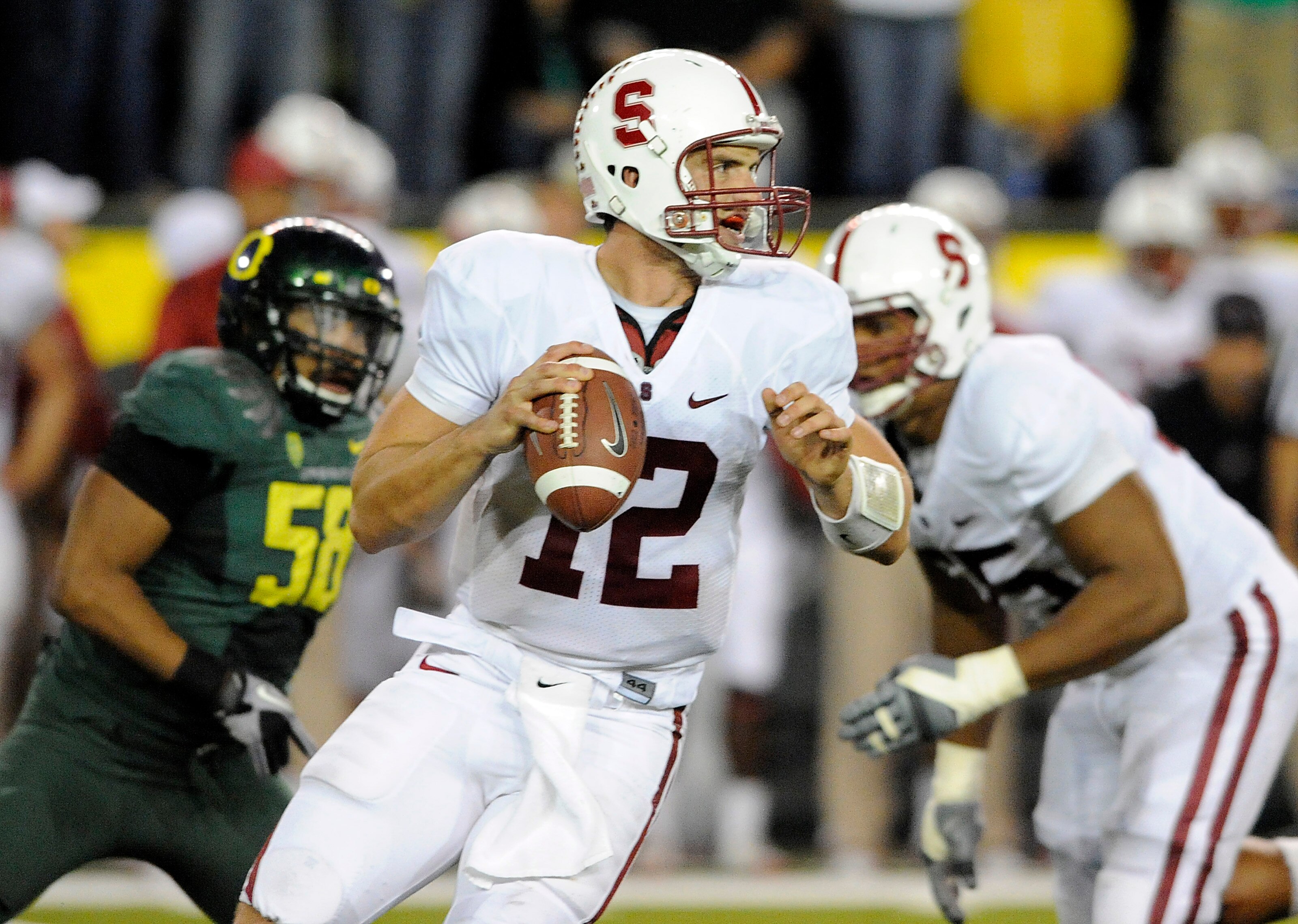 EUGENE, OR - OCTOBER 2: Quarterback Andrew Luck #12 of the Stanford Cardinal looks downfield to pass the ball in the third quarter of the game against the Oregon Ducks at Autzen Stadium on October 2, 2010 in Eugene, Oregon. Oregon won the game 52-31. (Pho