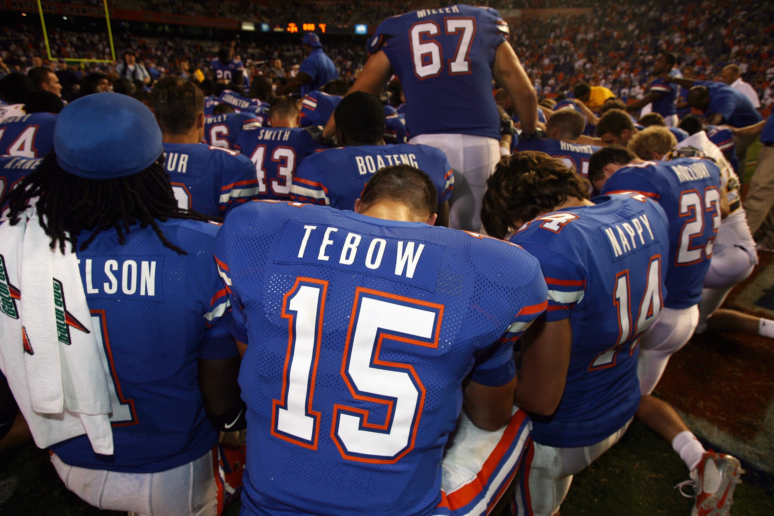 GAINESVILLE, FL - SEPTEMBER 2:  Quarterback Tim Tebow #15 of the University of Florida Gators prays with teammates following the game against the Southern Miss Golden Eagles at Ben Hill Griffin Stadium on September 2, 2006 in Gainesville, Florida.  The Ga