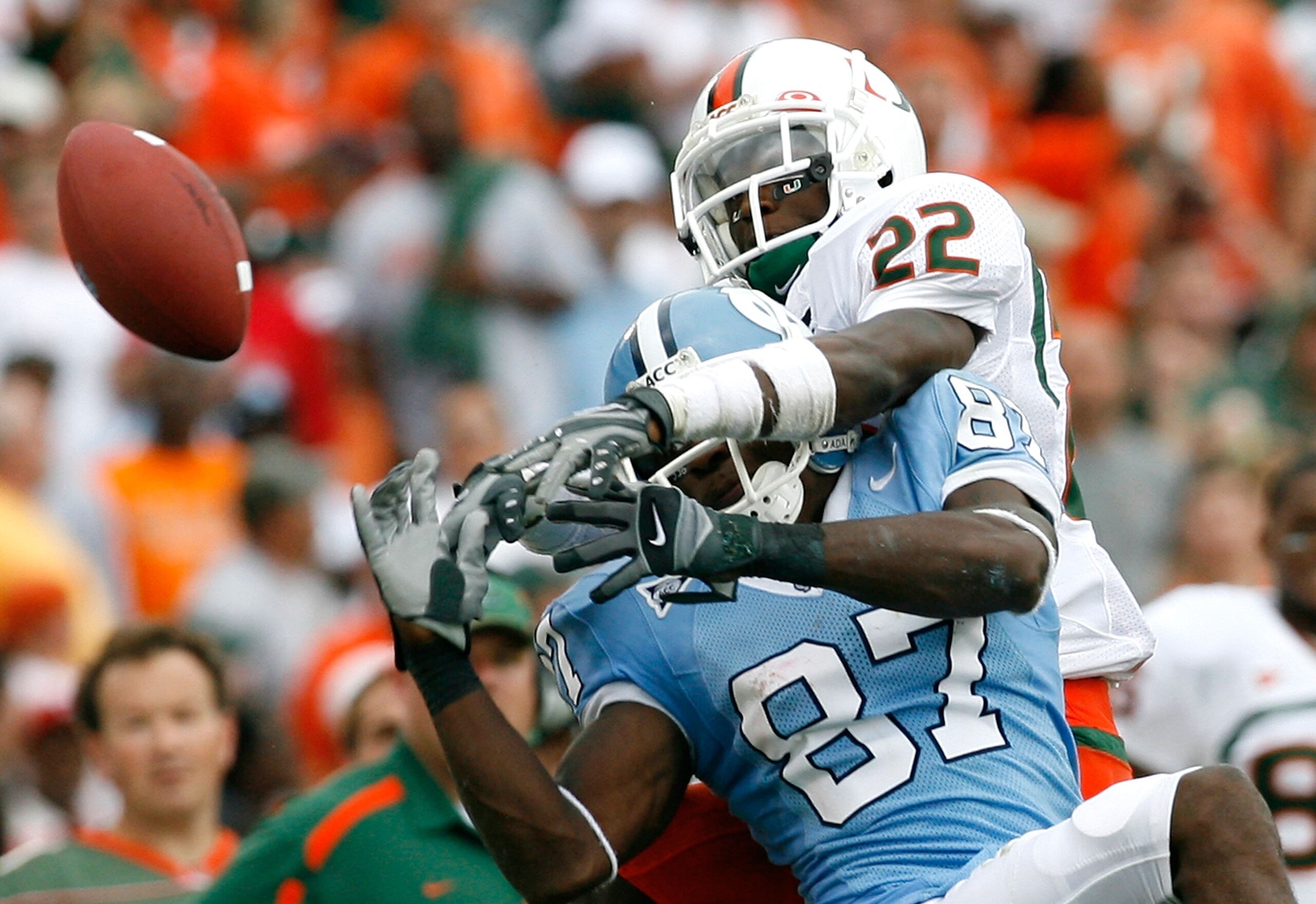 CHAPEL HILL, NC - OCTOBER 06:  Cornerback Bruce Johnson #22 of the Miami Hurricanes breaks up a pass intended for receiver Brandon Tate #87 of the North Carolina Tar Heels during the second half at Kenan Stadium on October 6, 2007 in Chapel Hill, North Ca