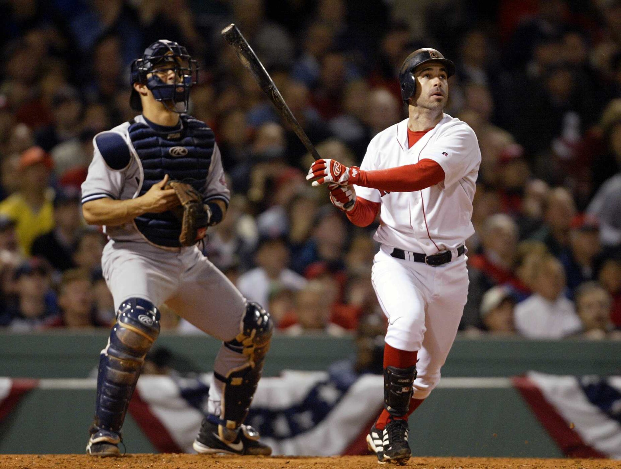 BOSTON - OCTOBER 13:  Todd Walker #12 of the Boston Red Sox hits a home run in the bottom of the fourth inning of Game 4 of the 2003 American League Championship Series against the New York Yankees October 13, 2003 at Fenway Park in Boston, Massachusetts.