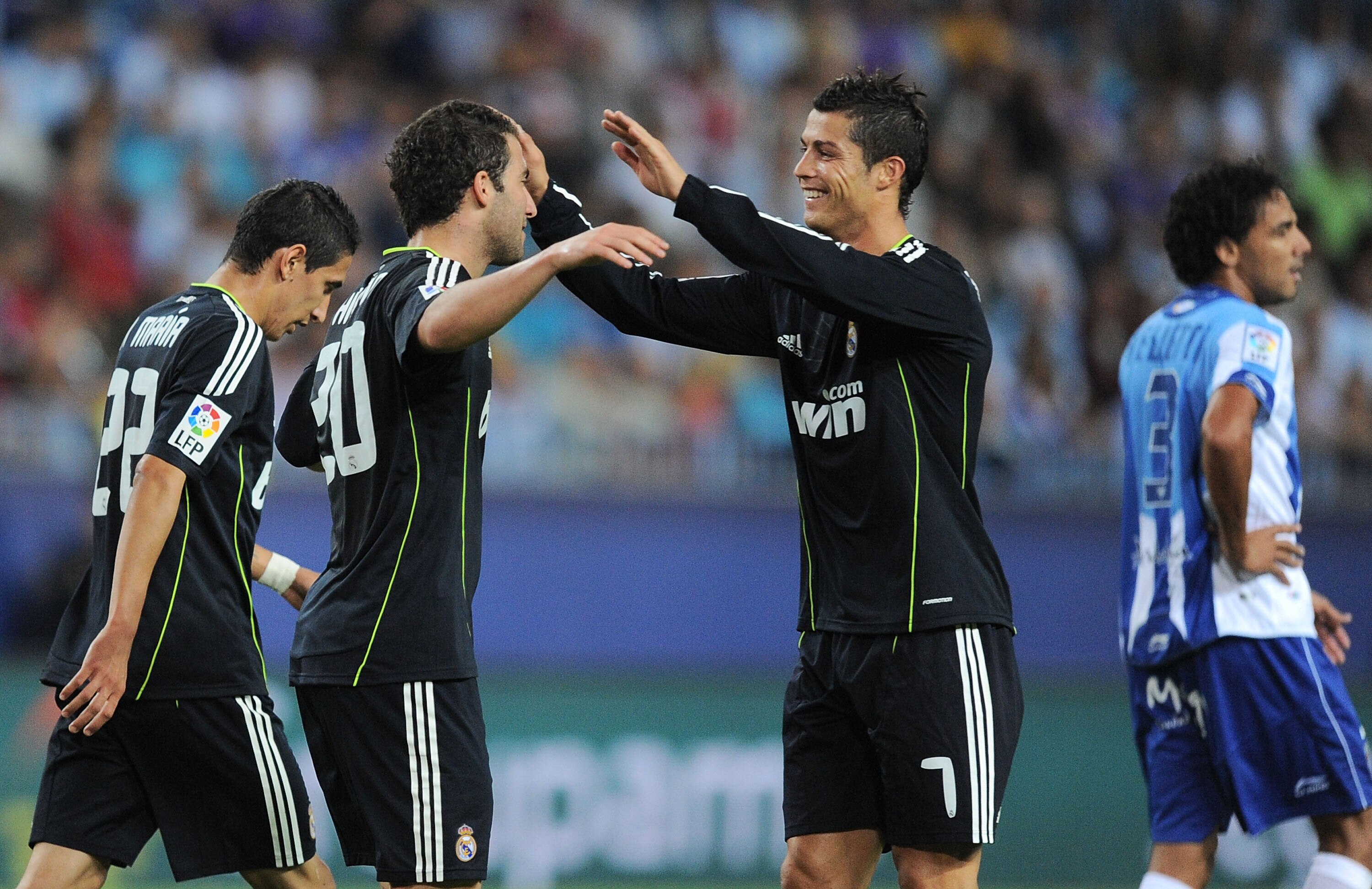 MALAGA, SPAIN - OCTOBER 16:  Cristiano Ronaldo (R) of Real Madrid celebrates with Gonzalo Higuain after Higuain scored Real's first goal during the La Liga match between Malaga and Real Madrid at La Rosaleda Stadium on October 16, 2010 in Malaga, Spain.
