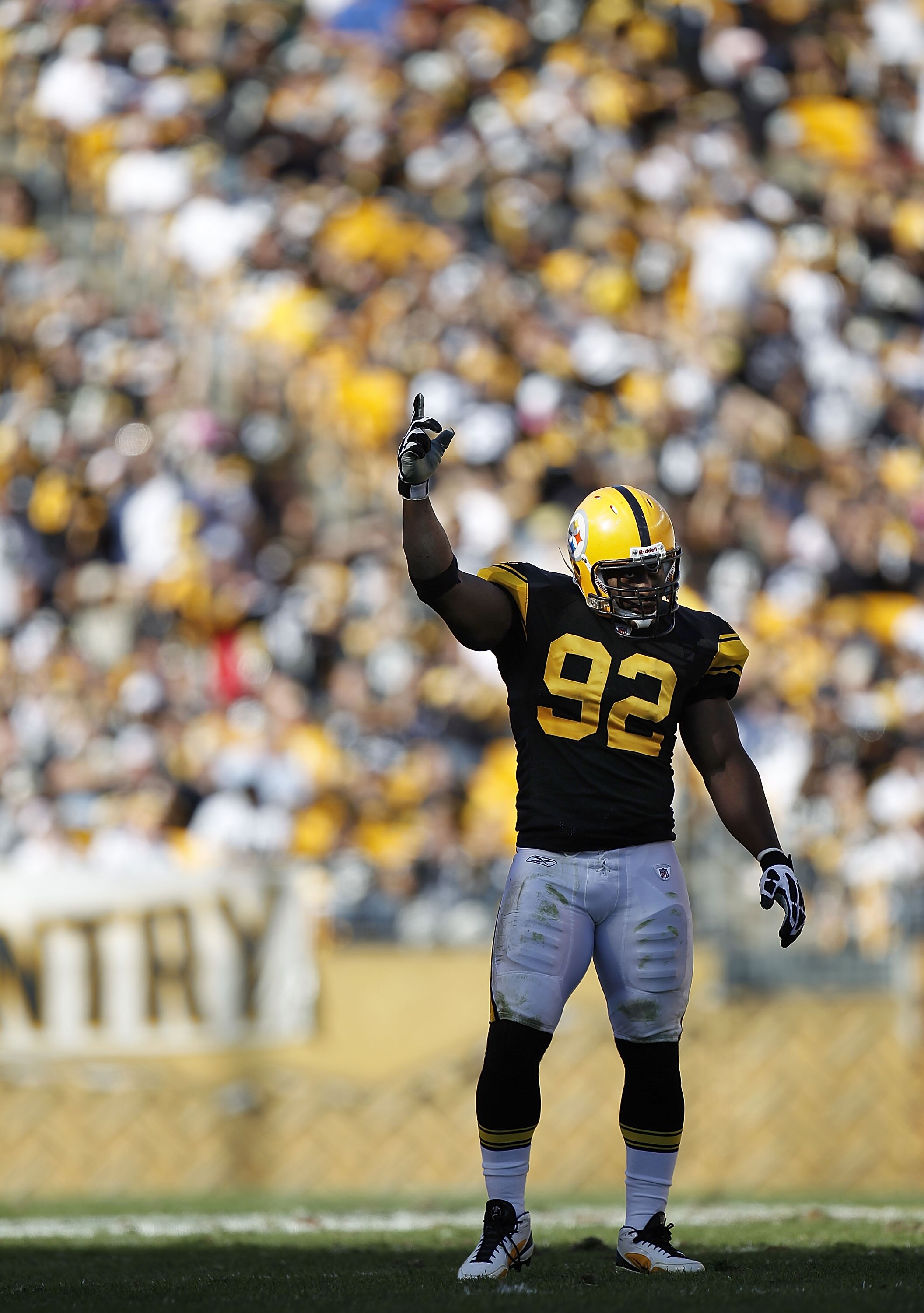 PITTSBURGH - OCTOBER 17:  James Harrison #92 of the Pittsburgh Steelers encourages the fans to make noise while playing the Cleveland Browns on October 17, 2010 at Heinz Field in Pittsburgh, Pennsylvania. Pittsburgh won the game 28-10.  (Photo by Gregory 