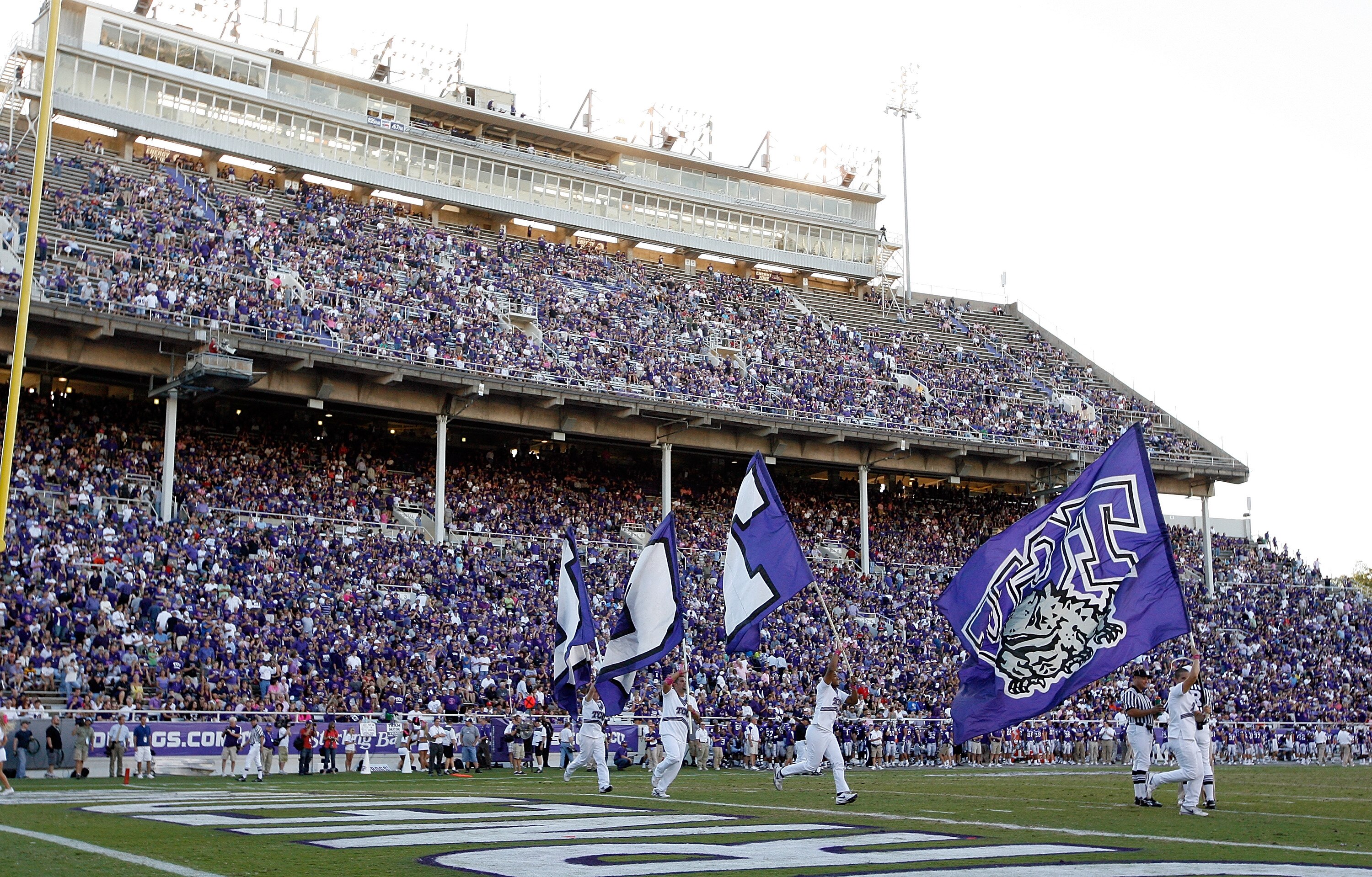 FORT WORTH, TX - OCTOBER 16: TCU Horned Frogs fans fill the stands as TCU takes to the field against the BYU Cougars at Amon G. Carter Stadium on October 16, 2010 in Fort Worth, Texas. TCU beat BYU 31-3. (Photo by Tom Pennington/Getty Images) FORT WORTH, TX - OCTOBER 16: TCU Horned Frogs fans fill the stands as TCU takes to the field against the BYU Cougars at Amon G. Carter Stadium on October 16, 2010 in Fort Worth, Texas. TCU beat BYU 31-3. (Photo by Tom Pennington/Getty Images)