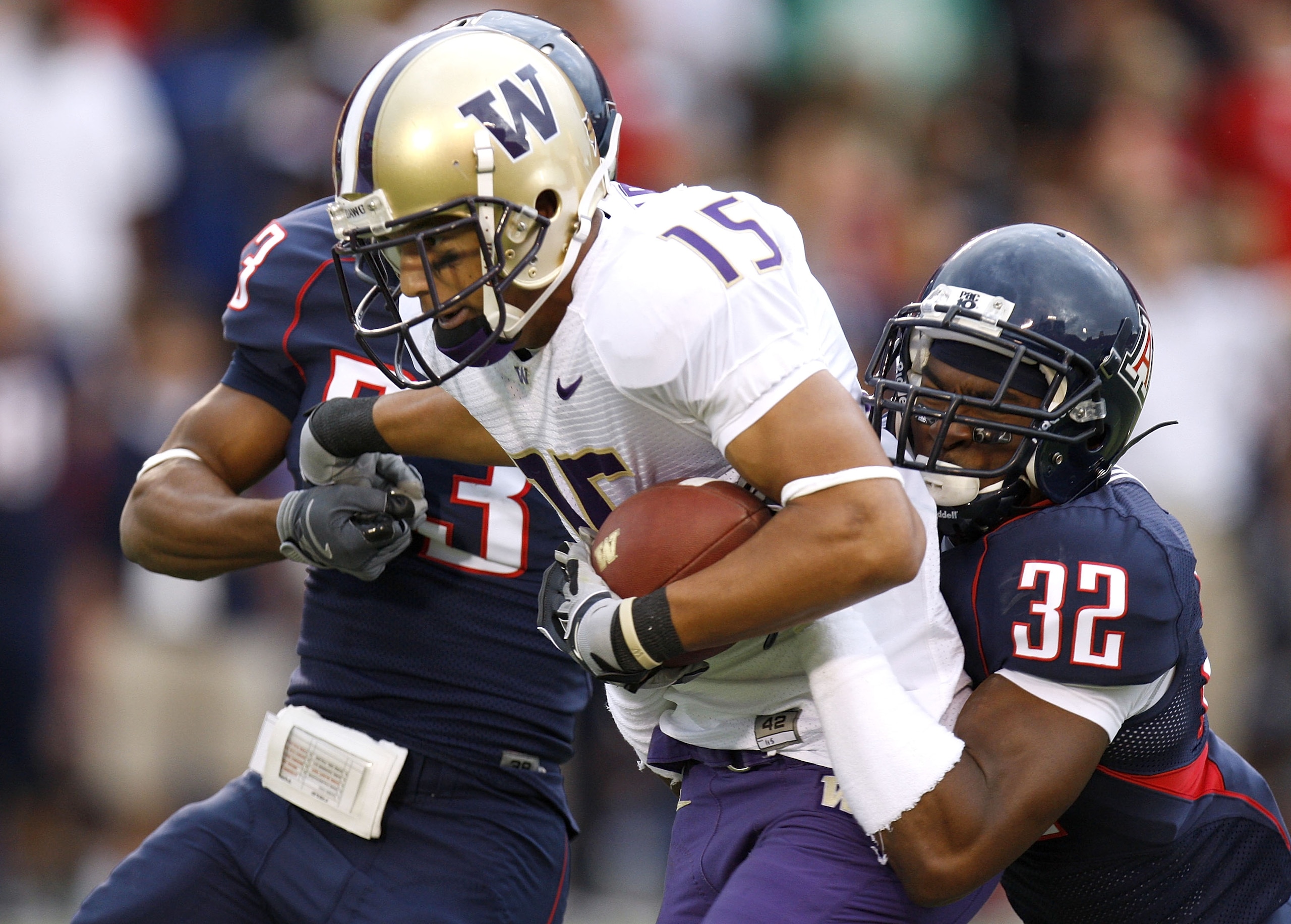 TUCSON, AZ - OCTOBER 04: Jermaine Kearse #15 of the Washington Huskies tries to get away from Nate Ness #32 and Marquis Hundley #23 of the Arizona Wildcats after a second quarter catch on October 4, 2008 at Arizona Stadium in Tucson, Arizona.  (Photo by G