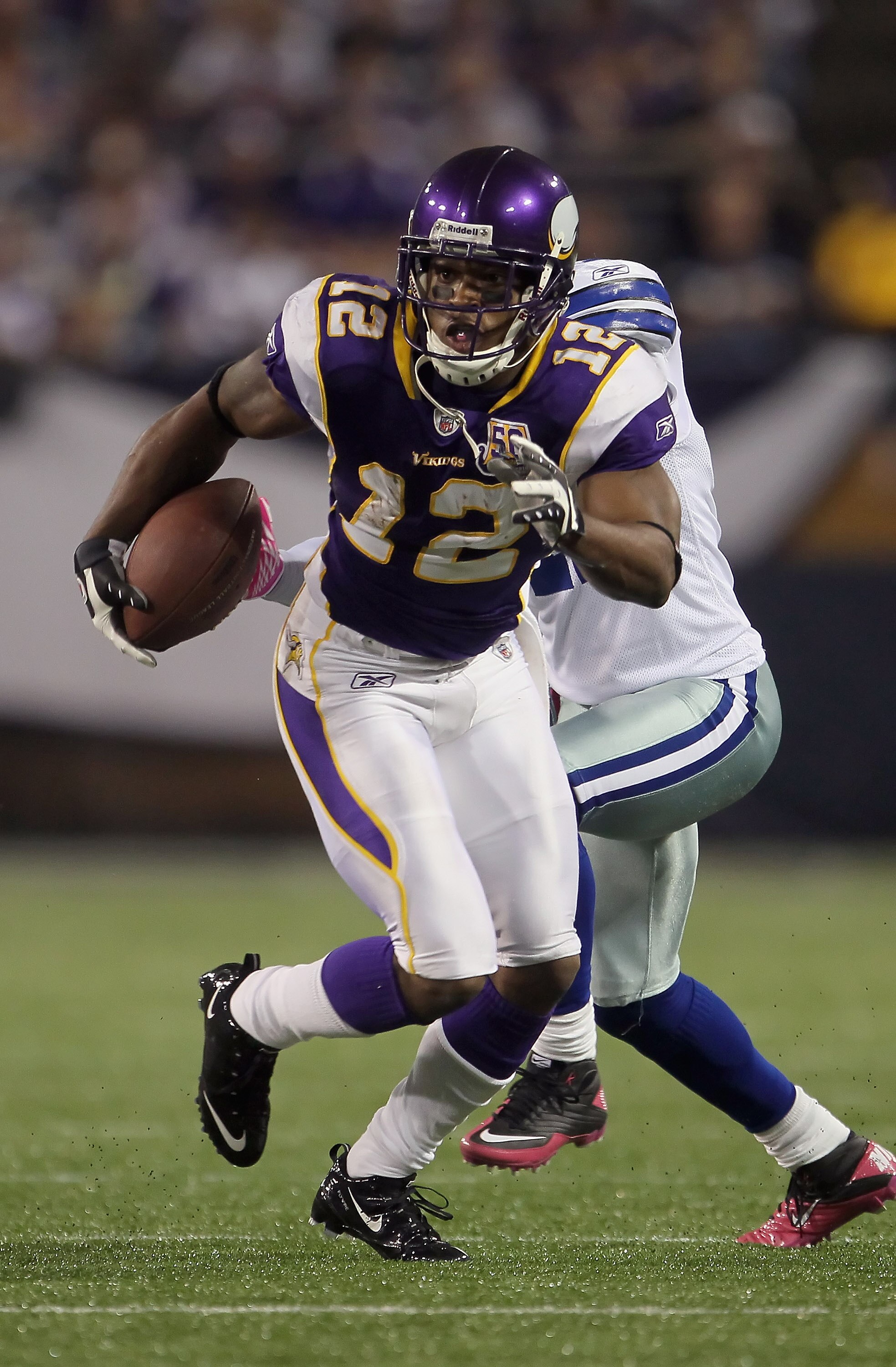MINNEAPOLIS - OCTOBER 17:  Wide receiver Percy Harvin #12 of the Minnesota Vikings runs after a reception during the second quarter against the Dallas Cowboys at Mall of America Field on October 17, 2010 in Minneapolis, Minnesota. The Vikings defeated the