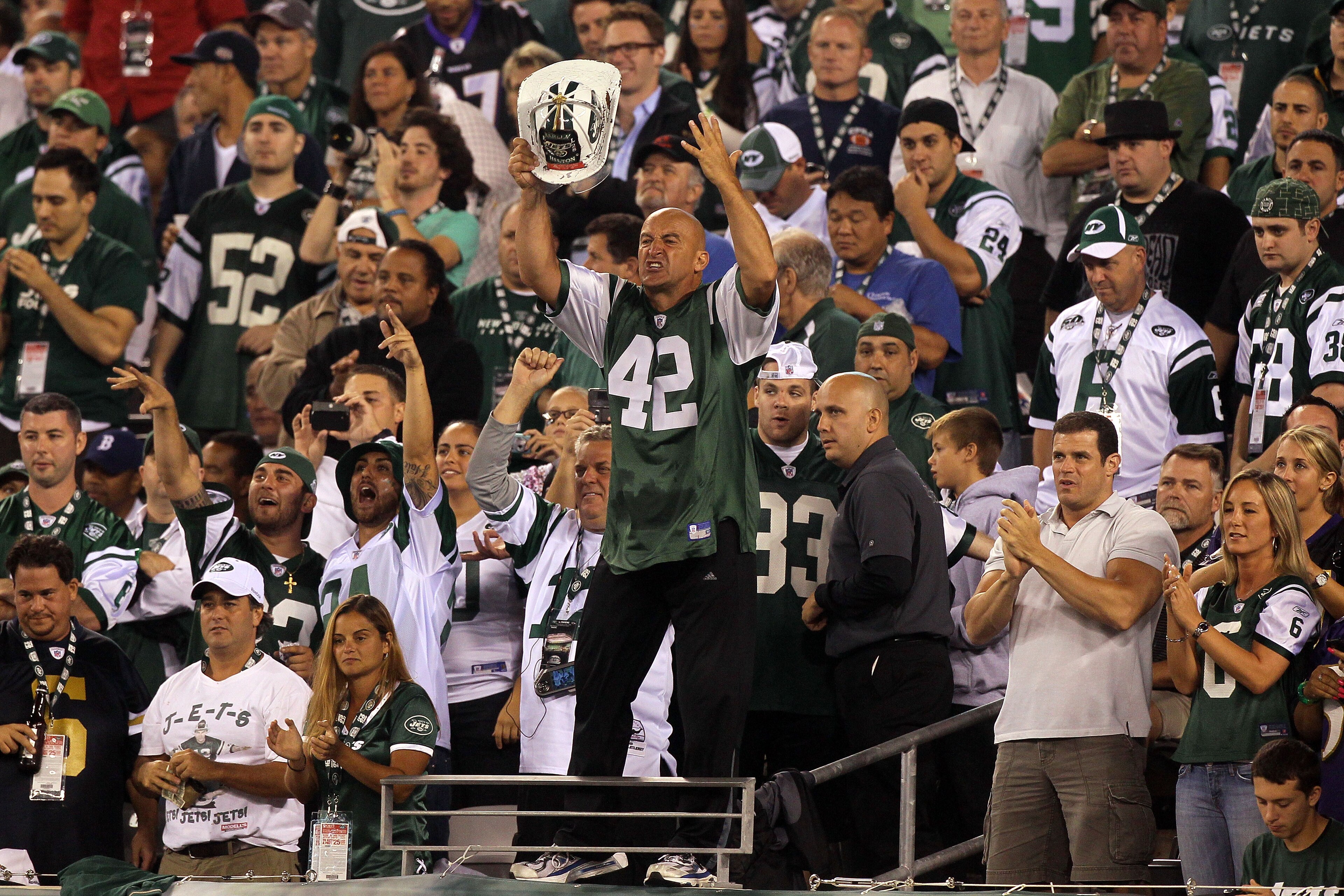 EAST RUTHERFORD, NJ - SEPTEMBER 13:  New York Jets fan fireman Ed Anzalone cheers for the New York Jets during their home opener against the Baltimore Ravens at the New Meadowlands Stadium on September 13, 2010 in East Rutherford, New Jersey.  (Photo by J