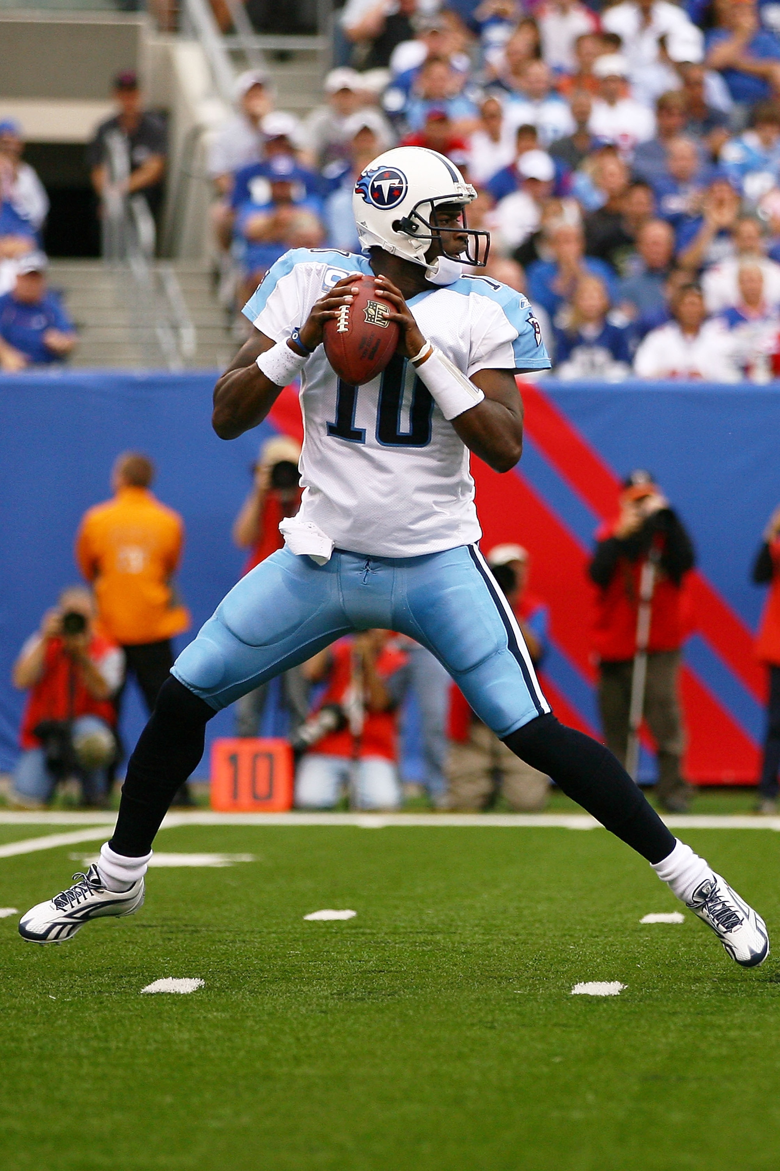 EAST RUTHERFORD, NJ - SEPTEMBER 26:  Vince Young #10 of the Tennessee Titans drops back against the New York Giants at New Meadowlands Stadium on September 26, 2010 in East Rutherford, New Jersey.  (Photo by Andrew Burton/Getty Images)
