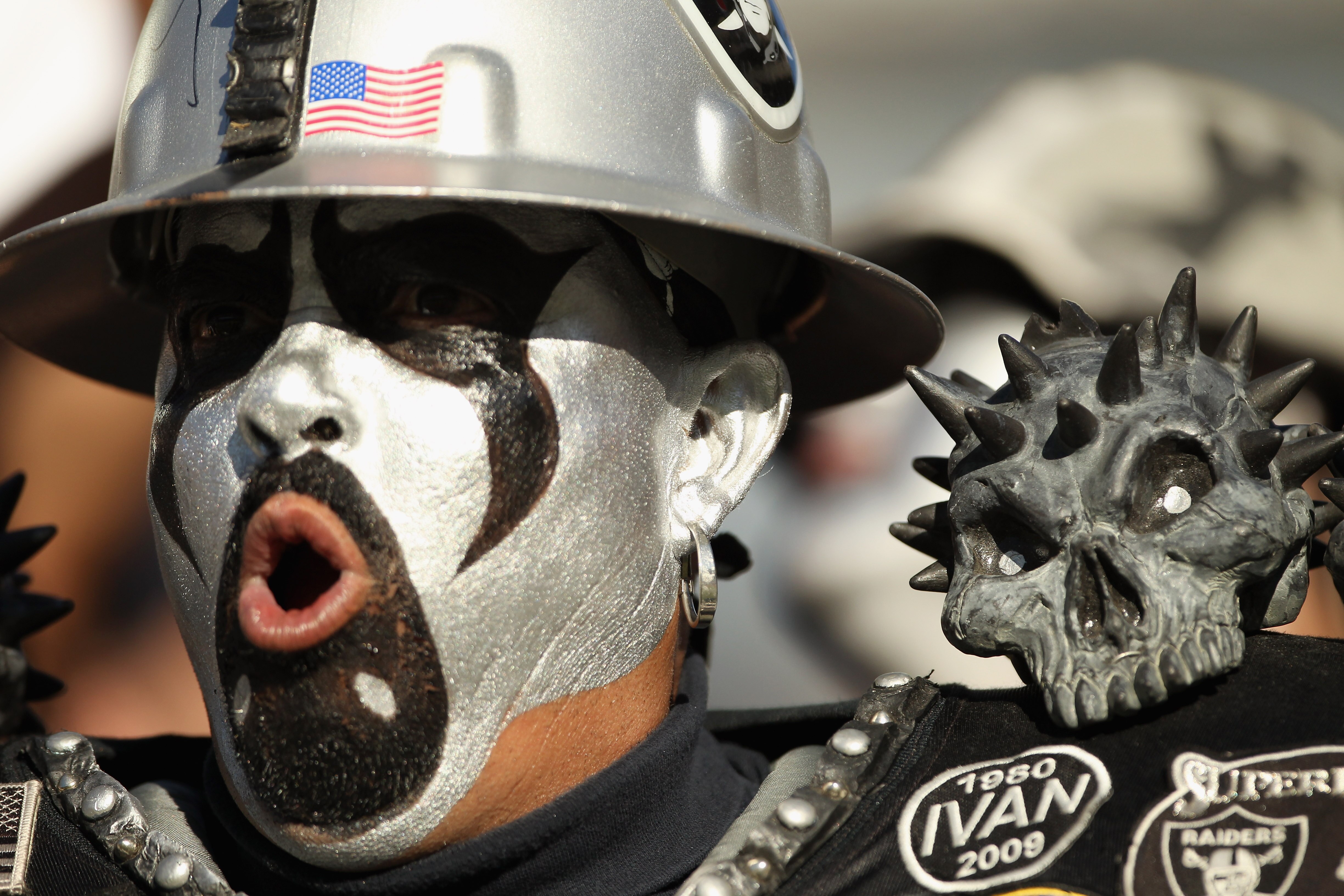 OAKLAND, CA - OCTOBER 10:  An Oakland Raiders fan cheers on his team during their game against the San Diego Chargers at Oakland-Alameda County Coliseum on October 10, 2010 in Oakland, California.  (Photo by Ezra Shaw/Getty Images)