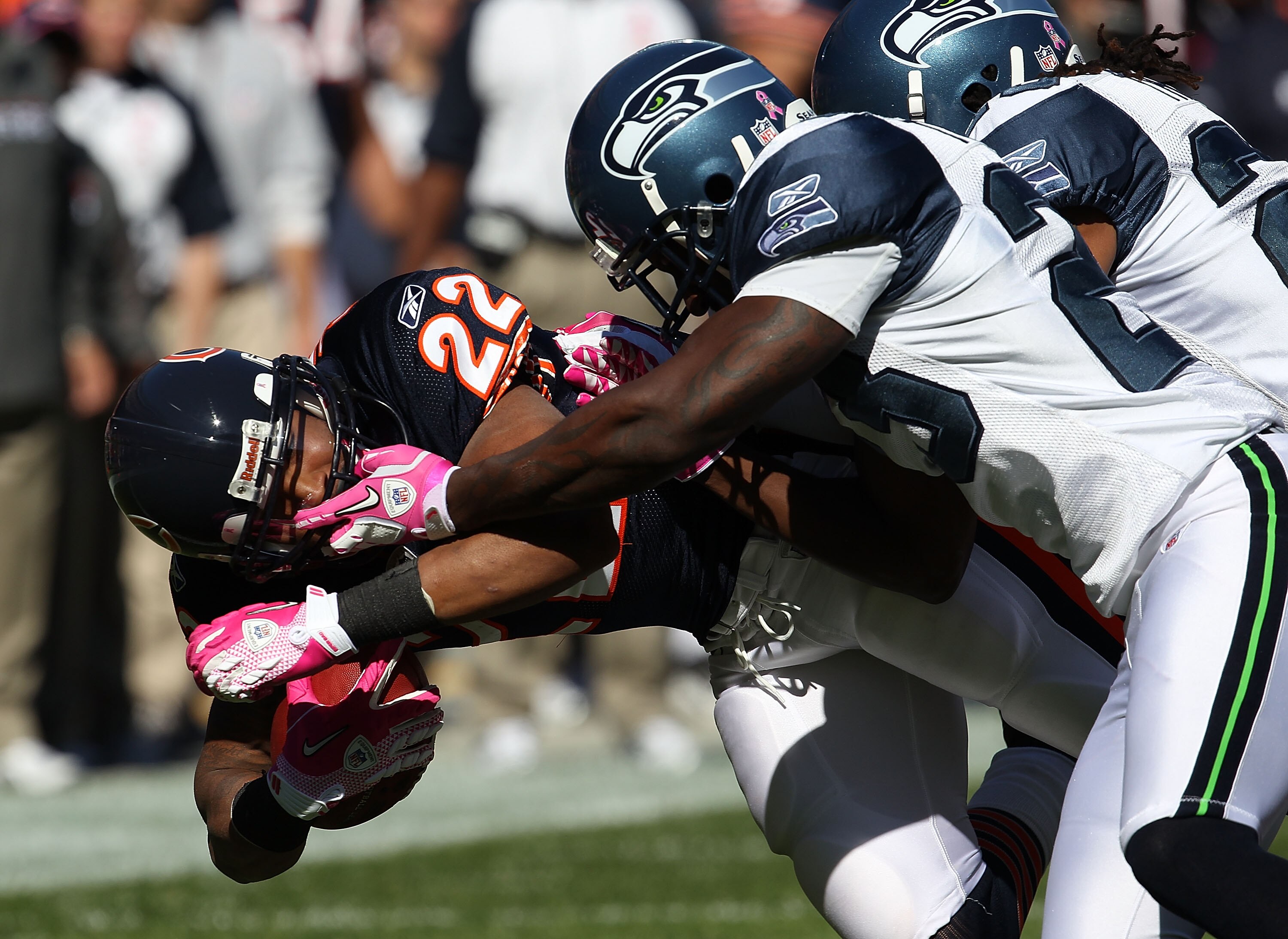 CHICAGO - OCTOBER 17: Matt Forte #22 of the Chicago Bears is tackled and grabbed by the face mask by Marcus Trufant #23 of the Seattle Seahawks at Soldier Field on October 17, 2010 in Chicago, Illinois. (Photo by Jonathan Daniel/Getty Images)
