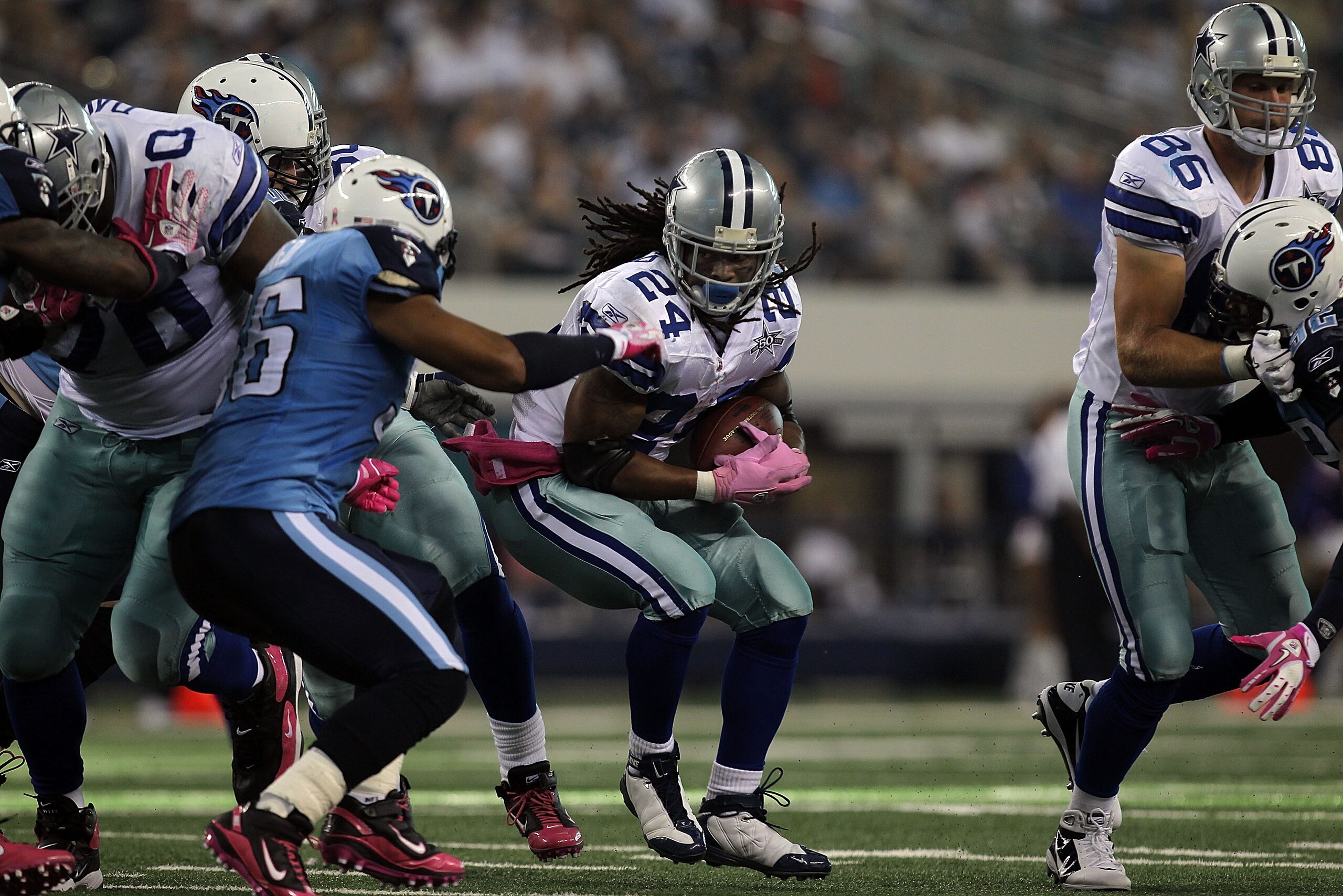 ARLINGTON, TX - OCTOBER 10:  Running back Marion Barber #24 of the Dallas Cowboys runs the ball against the Tennessee Titans at Cowboys Stadium on October 10, 2010 in Arlington, Texas.  (Photo by Ronald Martinez/Getty Images)