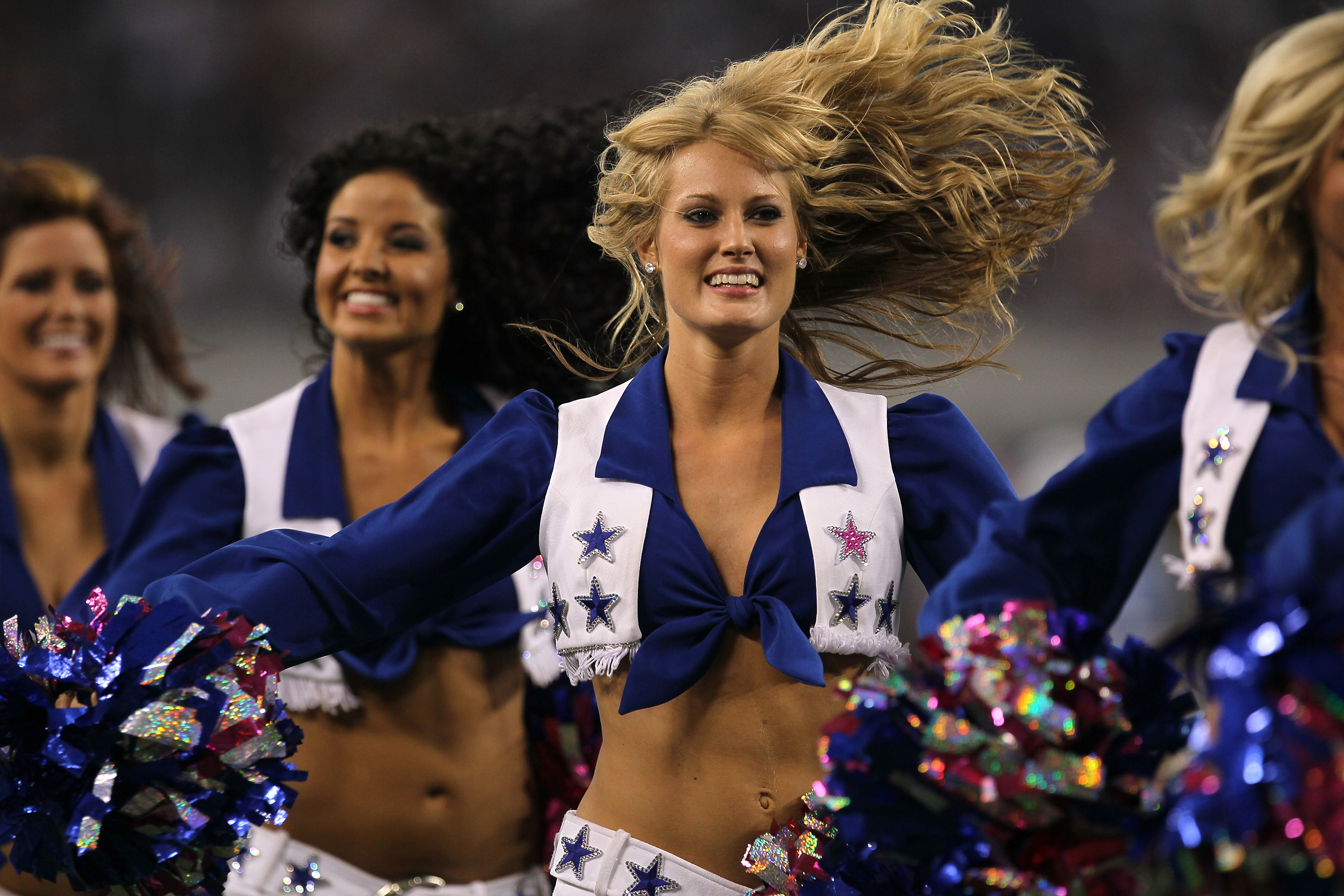 ARLINGTON, TX - OCTOBER 10:  The Dallas Cowboy Cheerleaders perform during the game with the Tennessee Titans at Cowboys Stadium on October 10, 2010 in Arlington, Texas. The Titans won 34-27.  (Photo by Stephen Dunn/Getty Images)