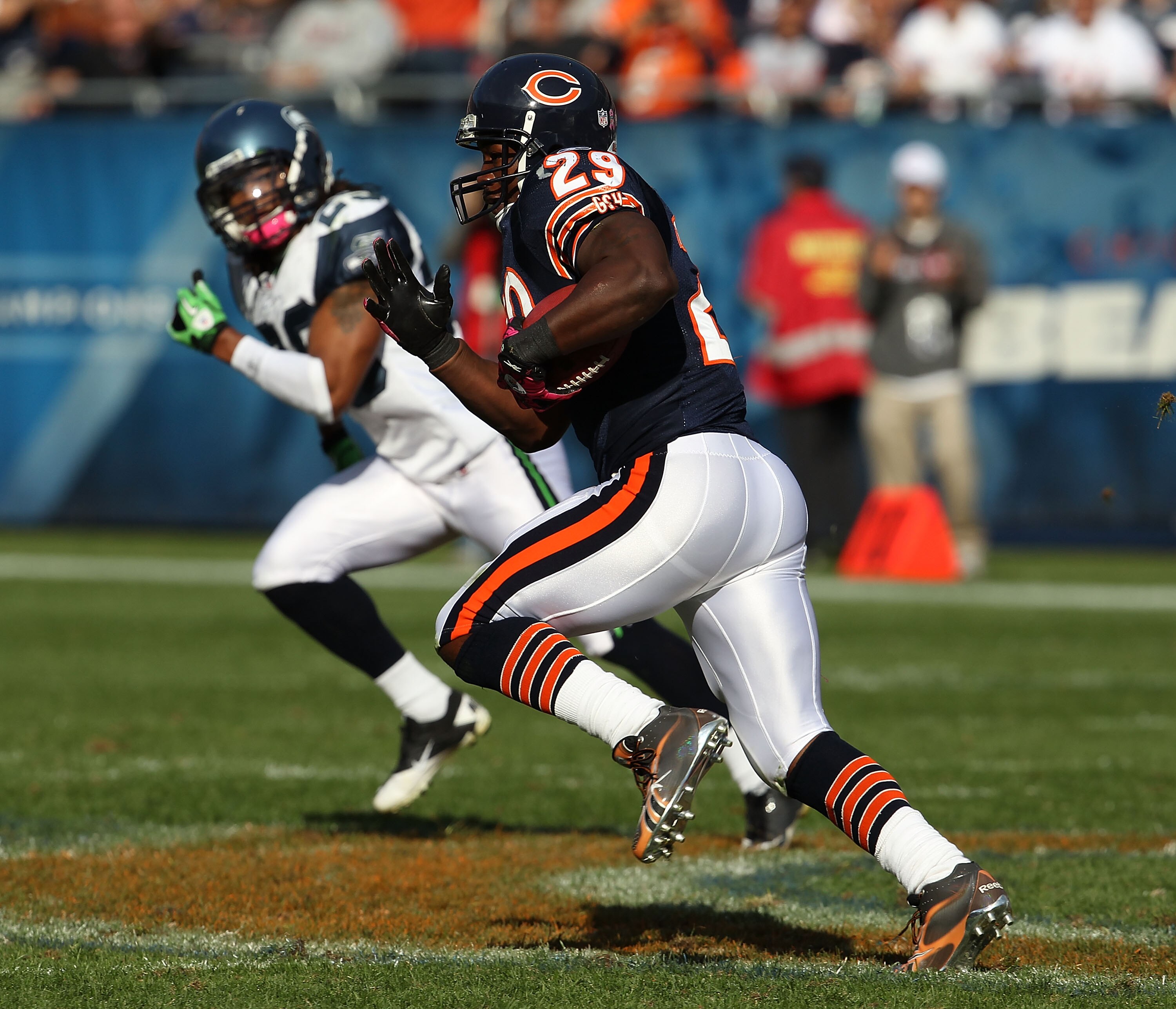 CHICAGO - OCTOBER 17: Chester Taylor #29 of the Chicago Bears runs for a first down pursued by Earl Thomas #29 of the Seattle Seahawks at Soldier Field on October 17, 2010 in Chicago, Illinois. The Seahawks defeated the Bears 23-20. (Photo by Jonathan Dan
