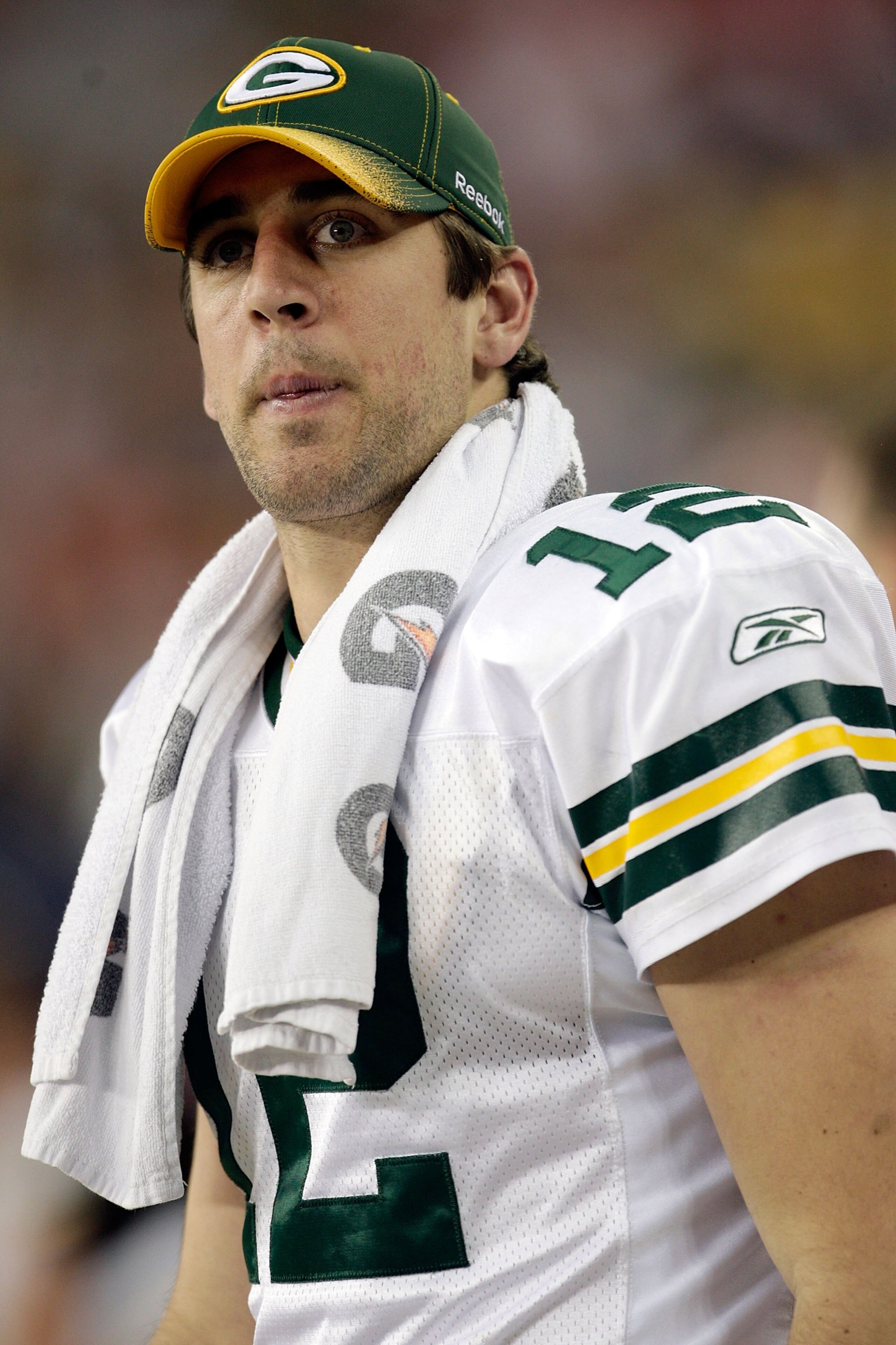 GLENDALE, AZ - JANUARY 03:  Quarterback Aaron Rodgers #12 of the Green Bay Packers looks on from the sideline against the Arizona Cardinals at University of Phoenix Stadium on January 3, 2010 in Glendale, Arizona.  (Photo by Jamie Squire/Getty Images)