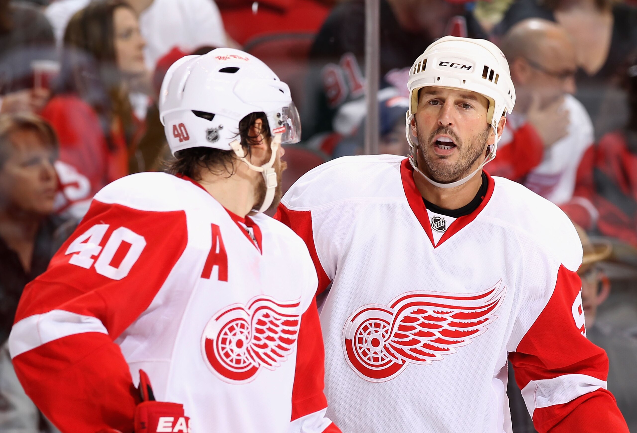 GLENDALE, AZ - OCTOBER 16:  Mike Modano #90 of the Detroit Red Wings talks with Henrik Zetterberg #40 during the NHL game against the Phoenix Coyotes at Jobing.com Arena on October16, 2010 in Glendale, Arizona.  The Red Wings defeated the Coyotes 2-1 in o