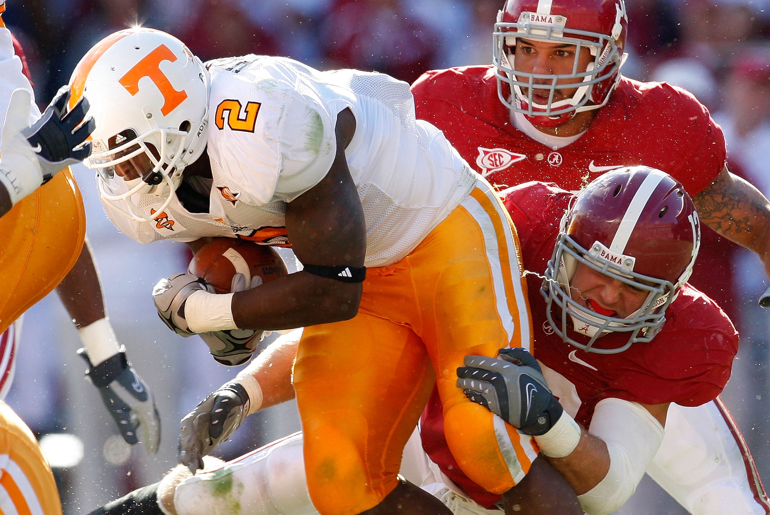TUSCALOOSA, AL - OCTOBER 24:  Cory Reamer #13 of the Alabama Crimson Tide tackles Montario Hardesty #2 of the Tennessee Volunteers at Bryant-Denny Stadium on October 24, 2009 in Tuscaloosa, Alabama.  (Photo by Kevin C. Cox/Getty Images)
