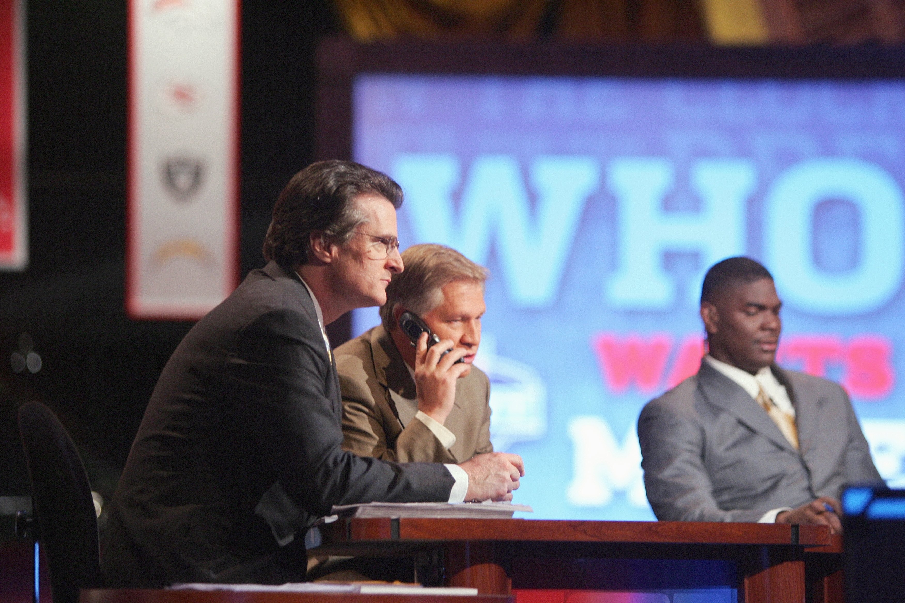NEW YORK - APRIL 28:  Mel Kiper, Chris Mortensen and Keyshawn Johnson broadcast for ESPN during the 2007 NFL Draft on April 28, 2007 at Radio City Music Hall in New York, New York. (Photo by Chris McGrath/Getty Images)