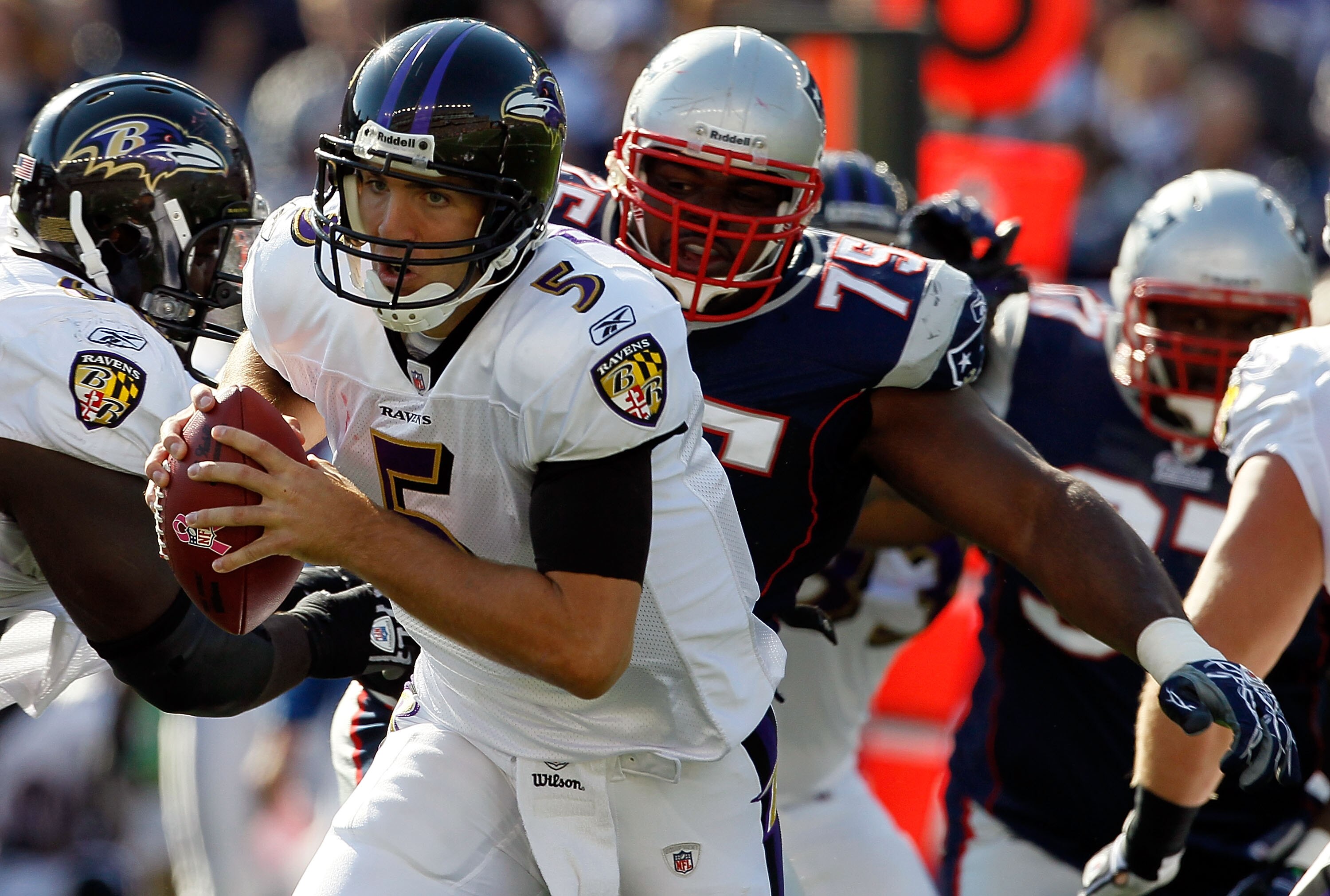 FOXBORO, MA - OCTOBER 17:  Vince Wilfork #75 of the New England Patriots chases Joe Flacco #5 of the Baltimore Ravens in the first half at Gillette Stadium on October 17, 2010 in Foxboro, Massachusetts. The Patriot won 23-20 in overtime.  (Photo by Jim Ro
