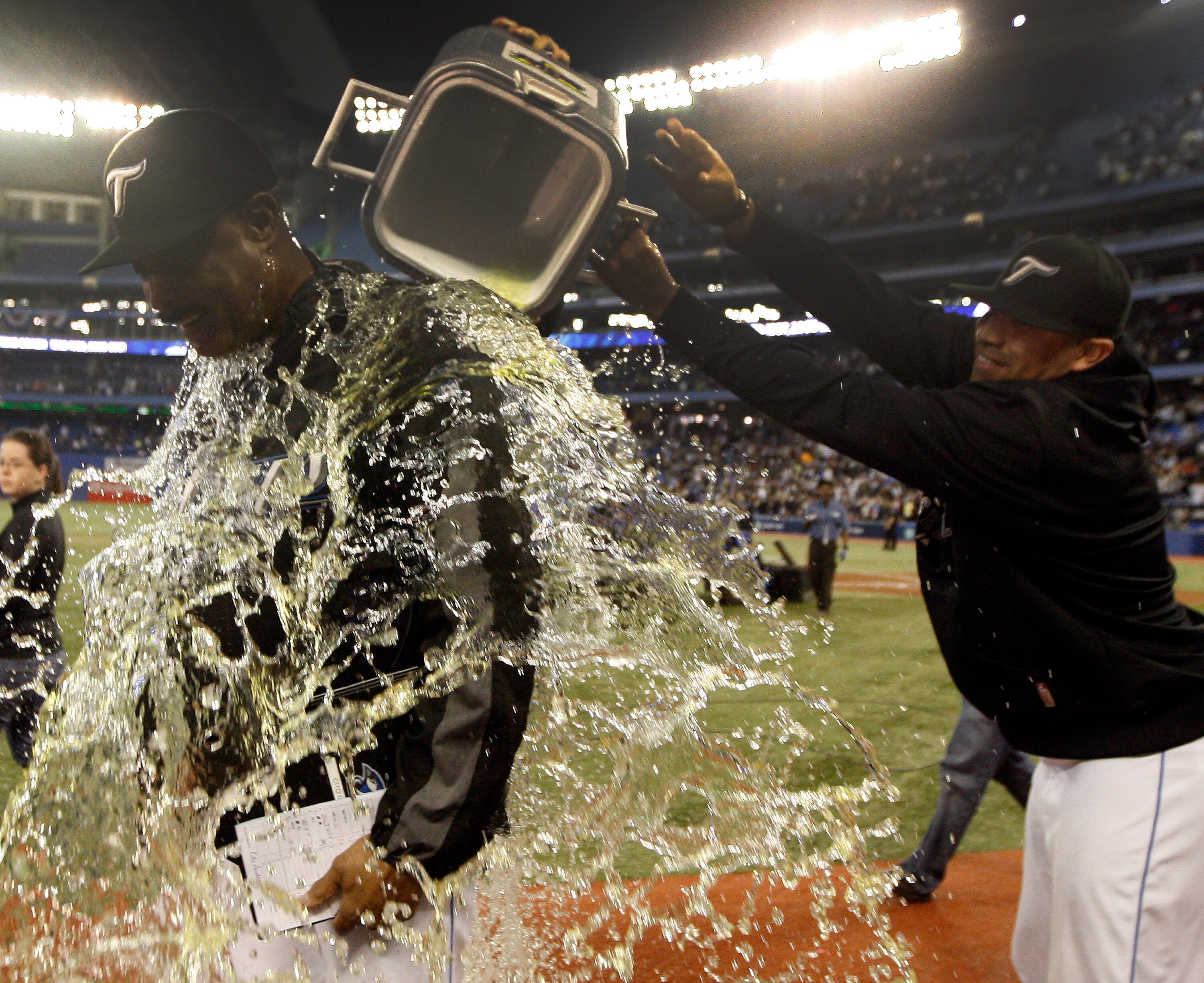 TORONTO, ON - SEPTEMBER 29:  Ricky Romero #24 (R) pours gatorade over Manager Cito Gaston after the Toronto Blue Jays defeated the the New York Yankees 8-4 during a MLB game at the Rogers Centre September 29, 2010 in Toronto, Ontario, Canada. (Photo by Ab