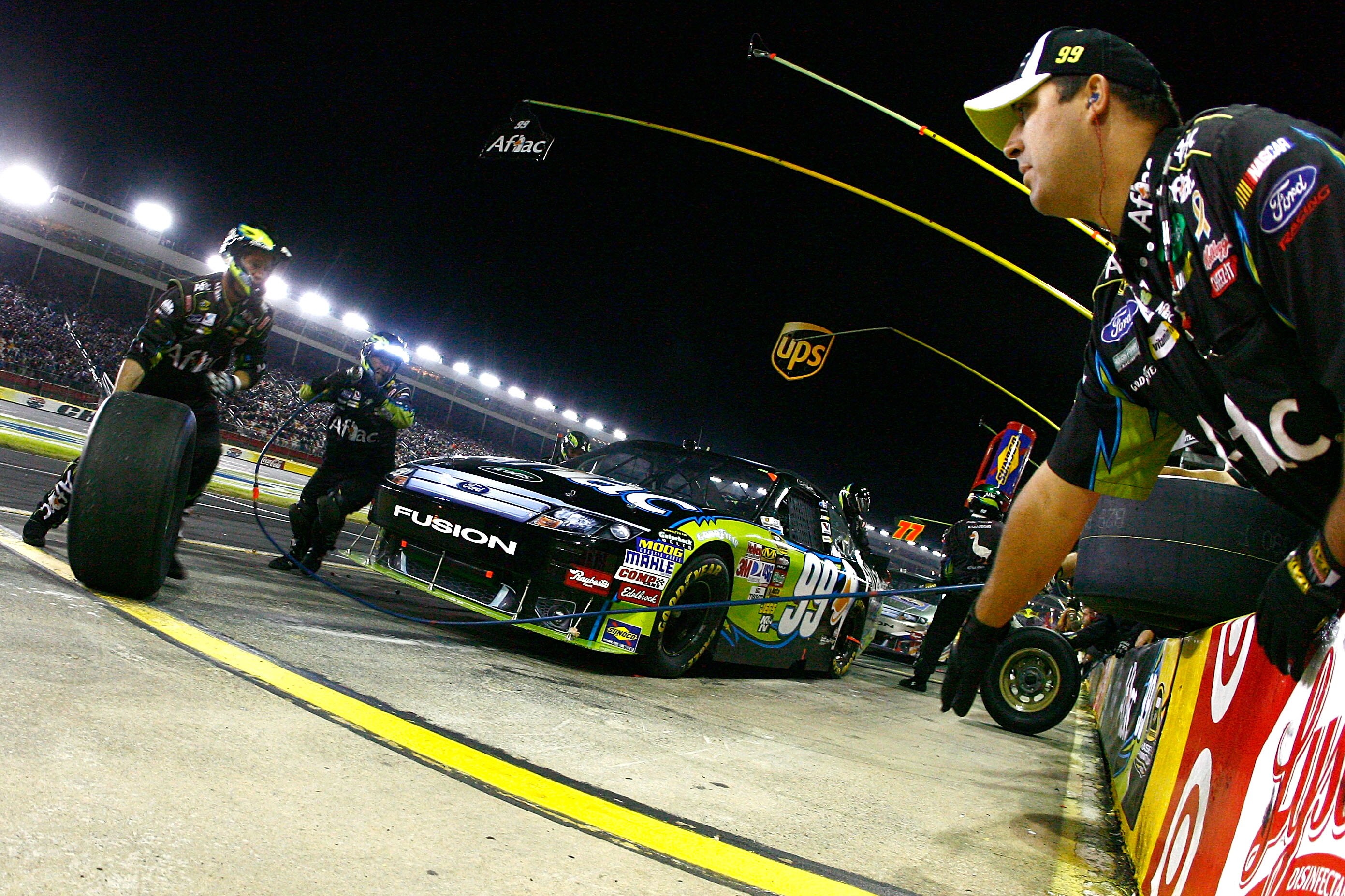 CONCORD, NC - OCTOBER 16:  Carl Edwards pits the #99 AFLAC Ford during the NASCAR Sprint Cup Series Bank of America 500 at Charlotte Motor Speedway on October 16, 2010 in Concord, North Carolina.  (Photo by Jason Smith/Getty Images for NASCAR)
