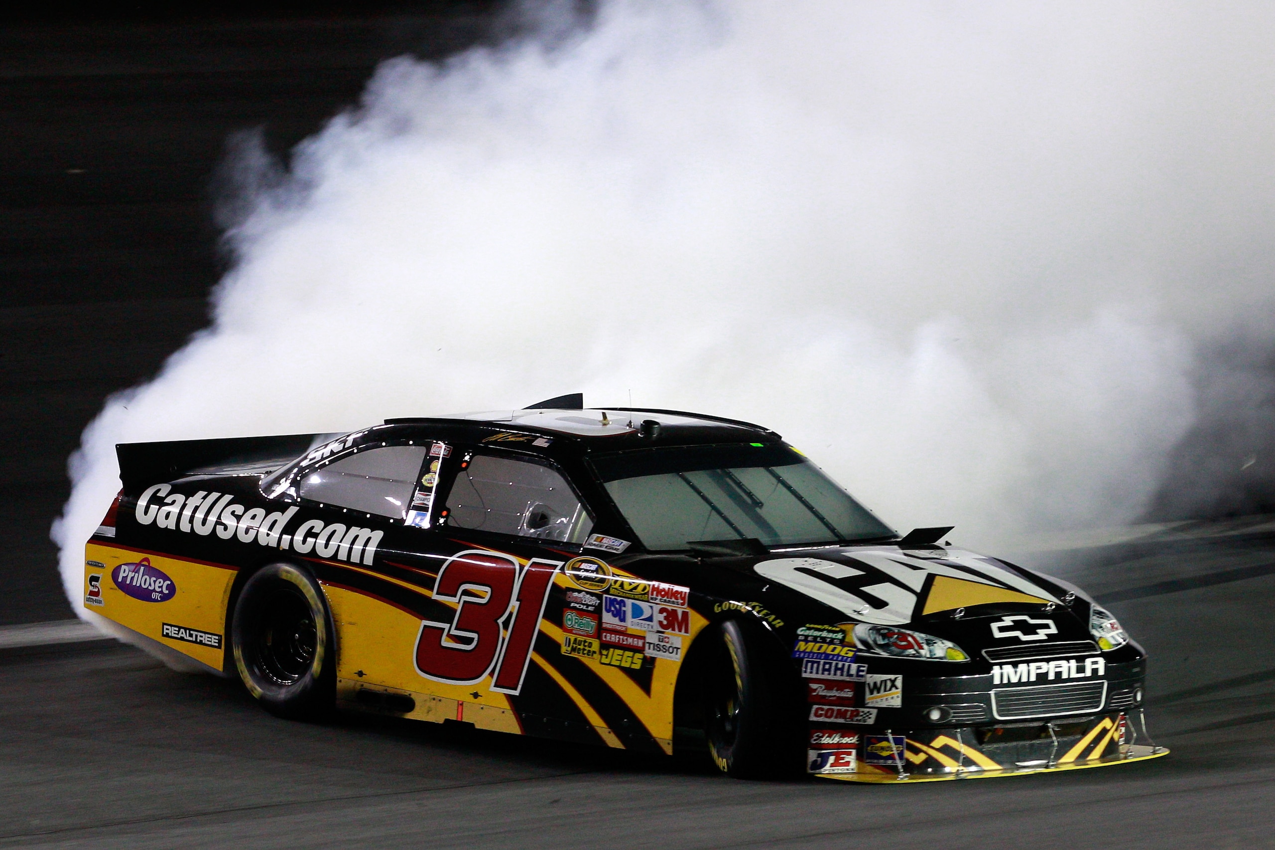 CONCORD, NC - OCTOBER 16:  Jeff Burton, driver of the #31 Caterpilliar Chevrolet, spins out after an incident in the NASCAR Sprint Cup Series Bank of America 500 at Charlotte Motor Speedway on October 16, 2010 in Concord, North Carolina.  (Photo by Sam Gr