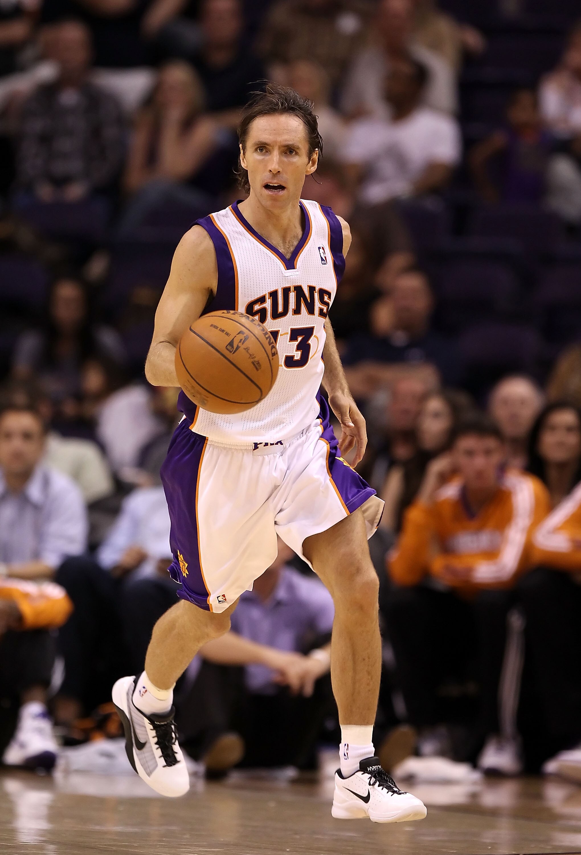 PHOENIX - OCTOBER 12:  Steve Nash #13 of the Phoenix Suns handles the ball during the preseason NBA game against the Utah Jazz at US Airways Center on October 12, 2010 in Phoenix, Arizona. NOTE TO USER: User expressly acknowledges and agrees that, by down