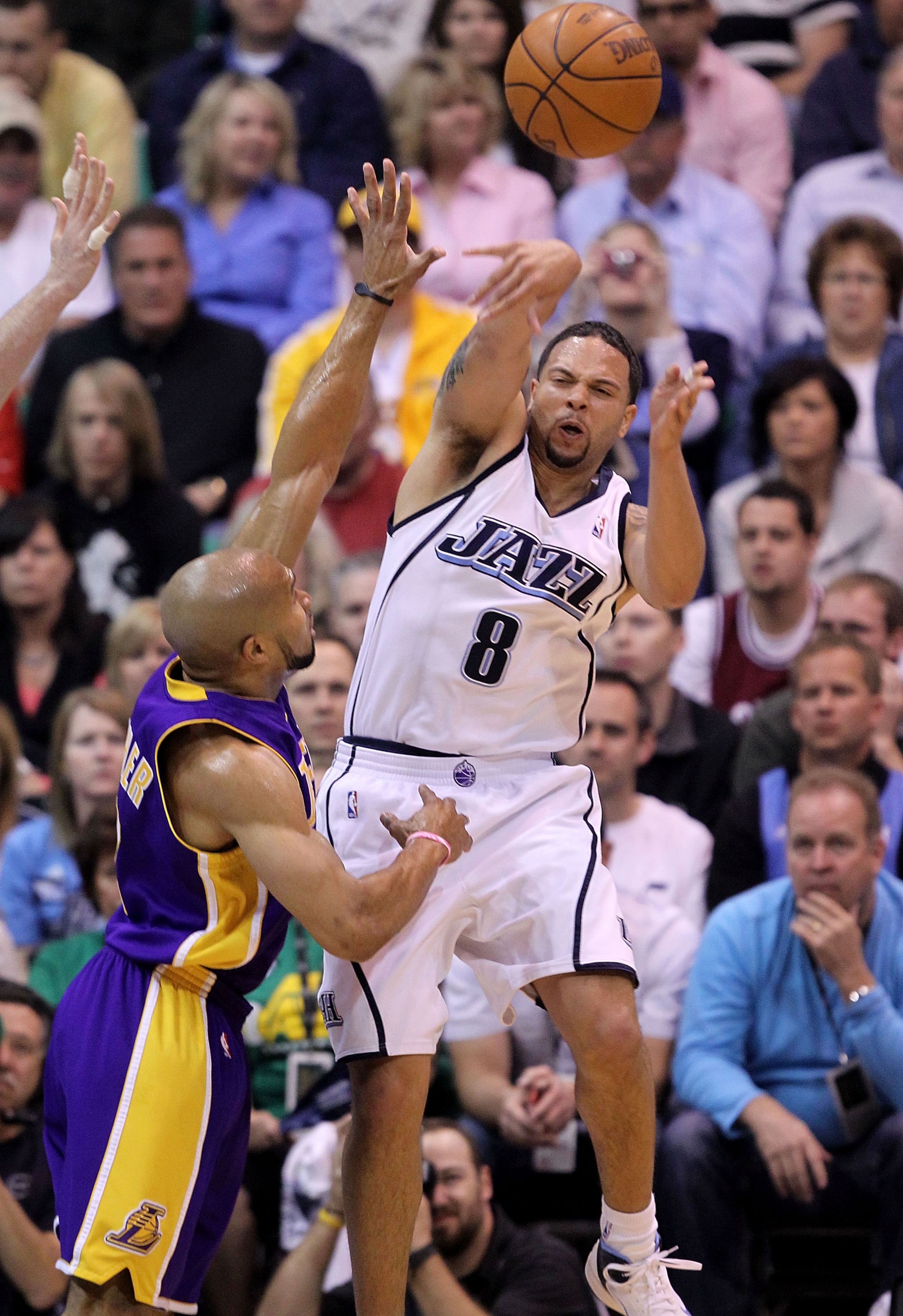 SALT LAKE CITY - MAY 10:  Deron Williams #8 of the Utah Jazz is defended by Derek Fisher #2 of the Los Angeles Lakers during Game Four of the Western Conference Semifinals of the 2010 NBA Playoffs on May 10, 2010 at Energy Solutions Arena in Salt Lake Cit