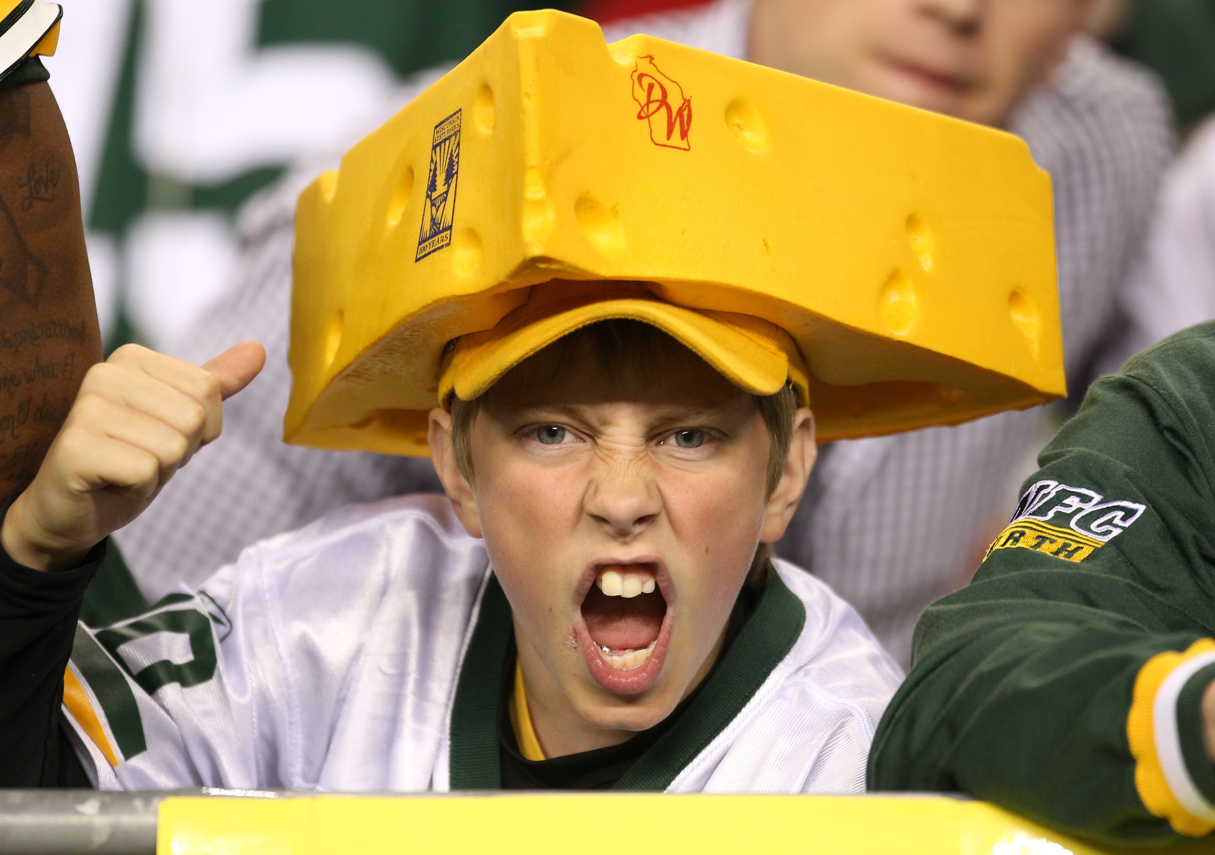 SEATTLE - AUGUST 21:  A fan of the Green Bay Packers cheers during the preseason game against the Seattle Seahawks at Qwest Field on August 21, 2010 in Seattle, Washington. (Photo by Otto Greule Jr/Getty Images)
