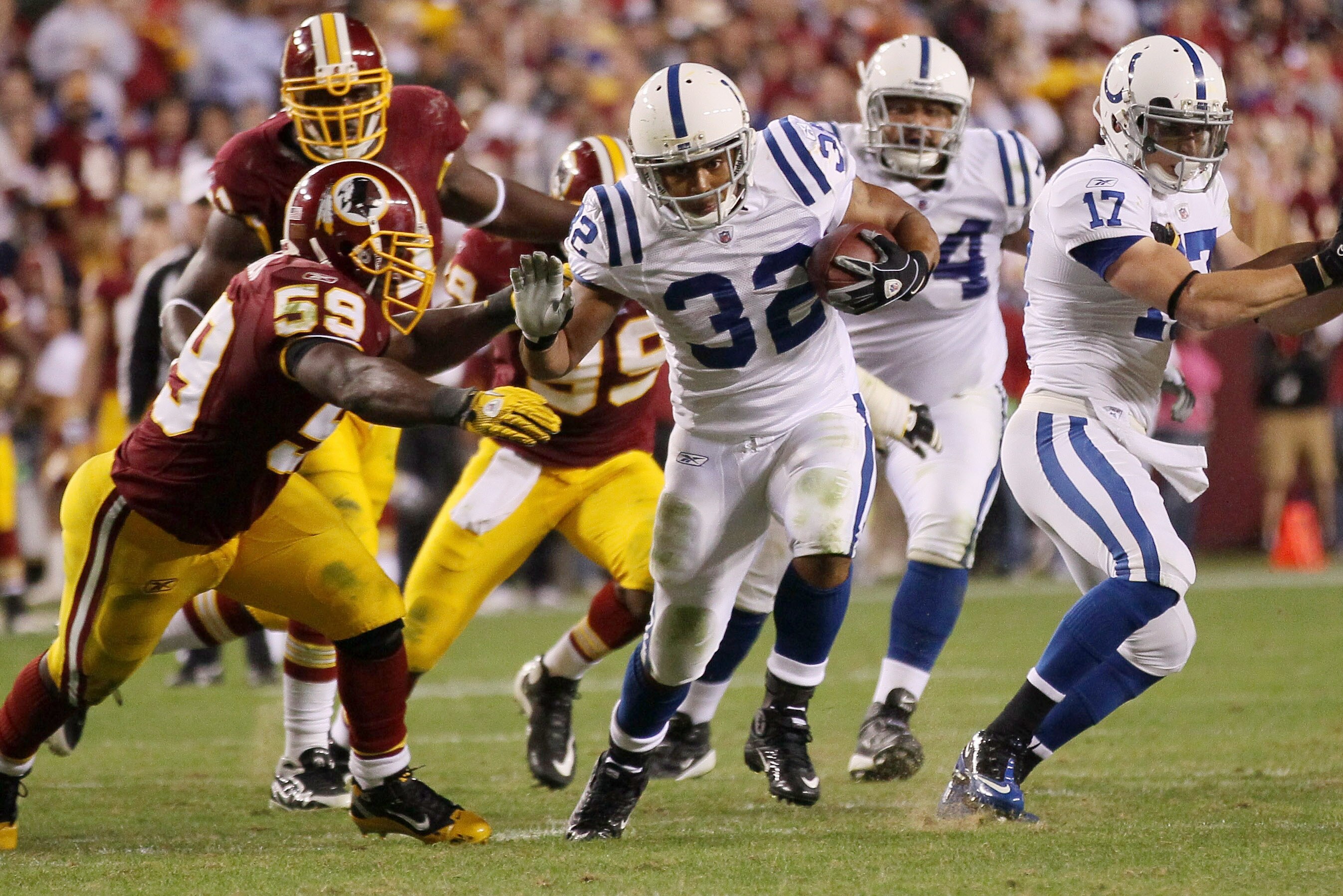 LANDOVER, MD - OCTOBER 17:  Running back Mike Hart #32 of the Indianapolis Colts is tackled by London Fletcher #59 of the Washington Redskins at FedEx Field on October 17, 2010 in Landover, Maryland. The Colts won the game 27-24.  (Photo by Win McNamee/Ge
