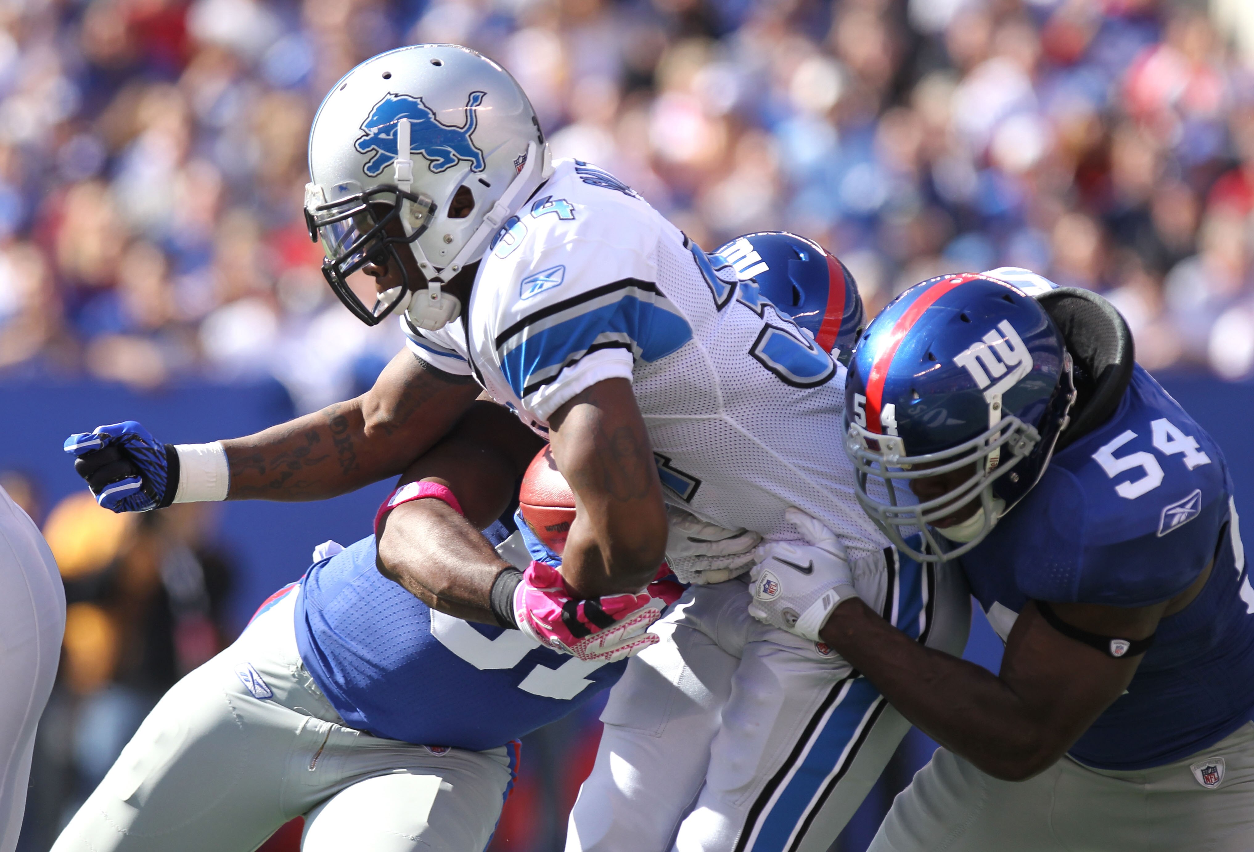 EAST RUTHERFORD, NJ - OCTOBER 17: Kevin Smith #34 of the Detroit Lions is tackled by Jonathan Goff #54 of the New York Giants at New Meadowlands Stadium on October 17, 2010 in East Rutherford, New Jersey.  (Photo by Nick Laham/Getty Images)