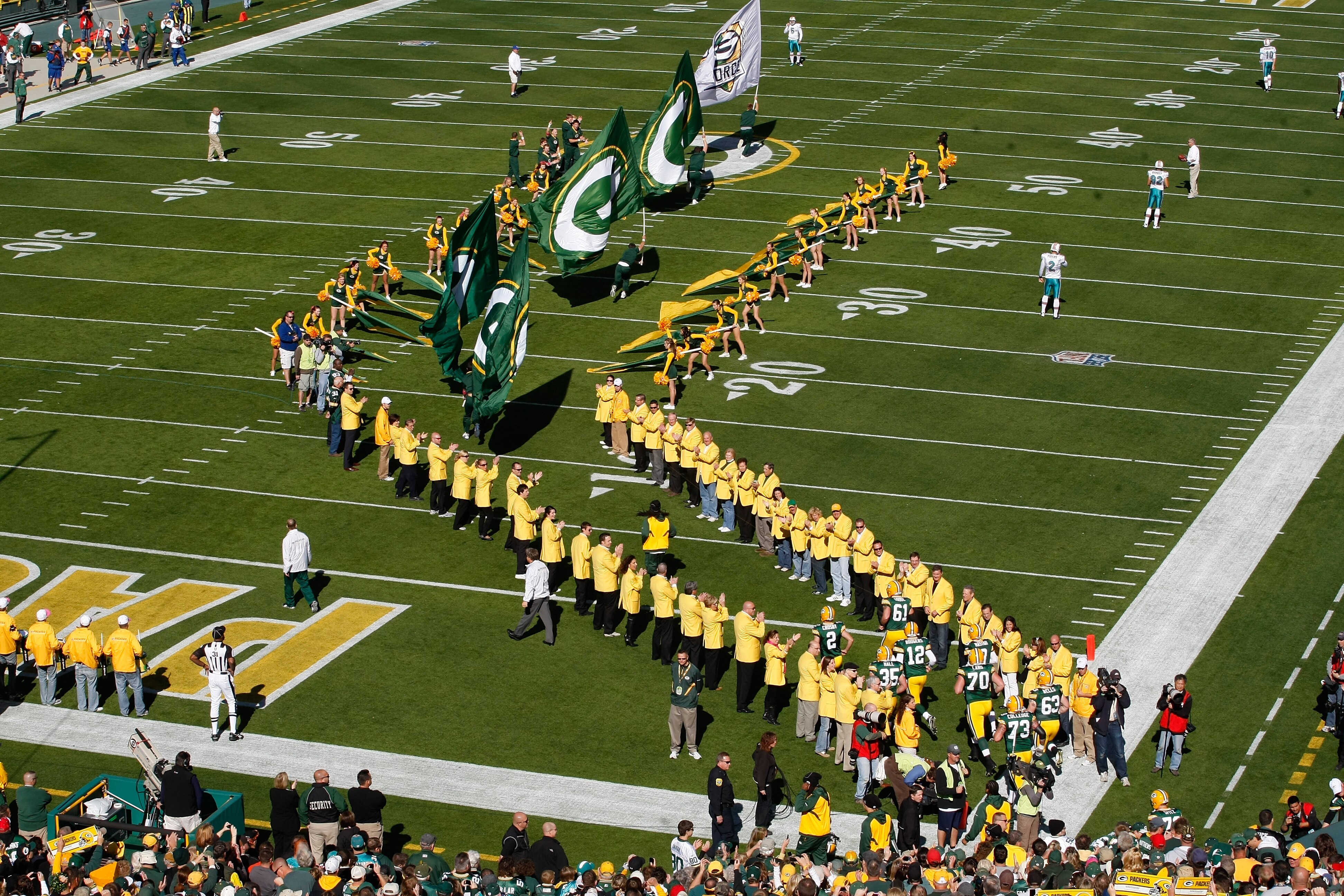 GREEN BAY, WI - OCTOBER 17: Packers players run on the field during introductions prior to the game between the Miami Dolphins against the Green Bay Packers at Lambeau Field on October 17, 2010 in Green Bay, Wisconsin. (Photo by Scott Boehm/Getty Images)