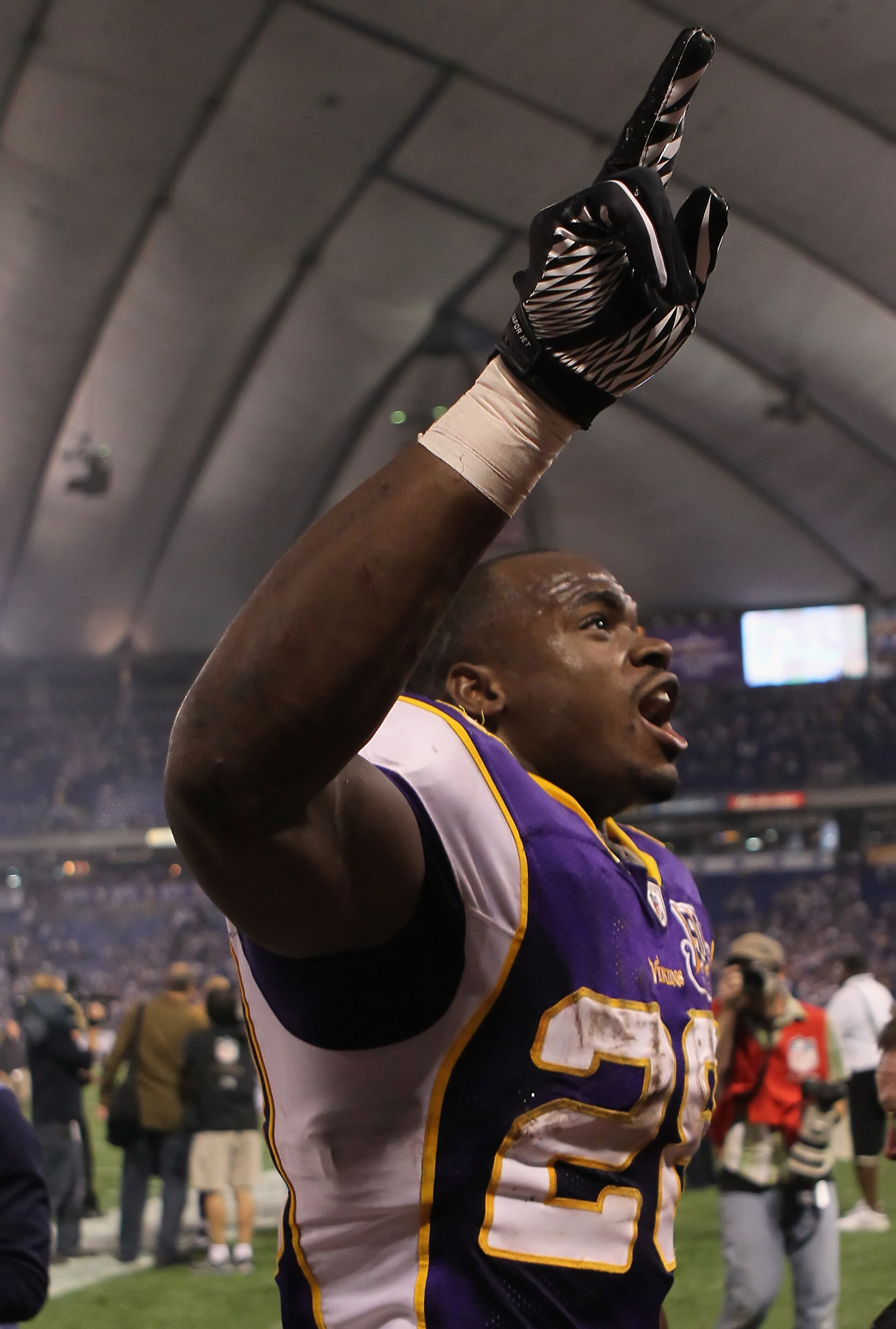 MINNEAPOLIS - OCTOBER 17:  Running back Adrian Peterson #29 of the Minnesota Vikings celebrates following his teams victory over the Dallas Cowboys at Mall of America Field on October 17, 2010 in Minneapolis, Minnesota.  The Vikings defeated the Cowboys 2
