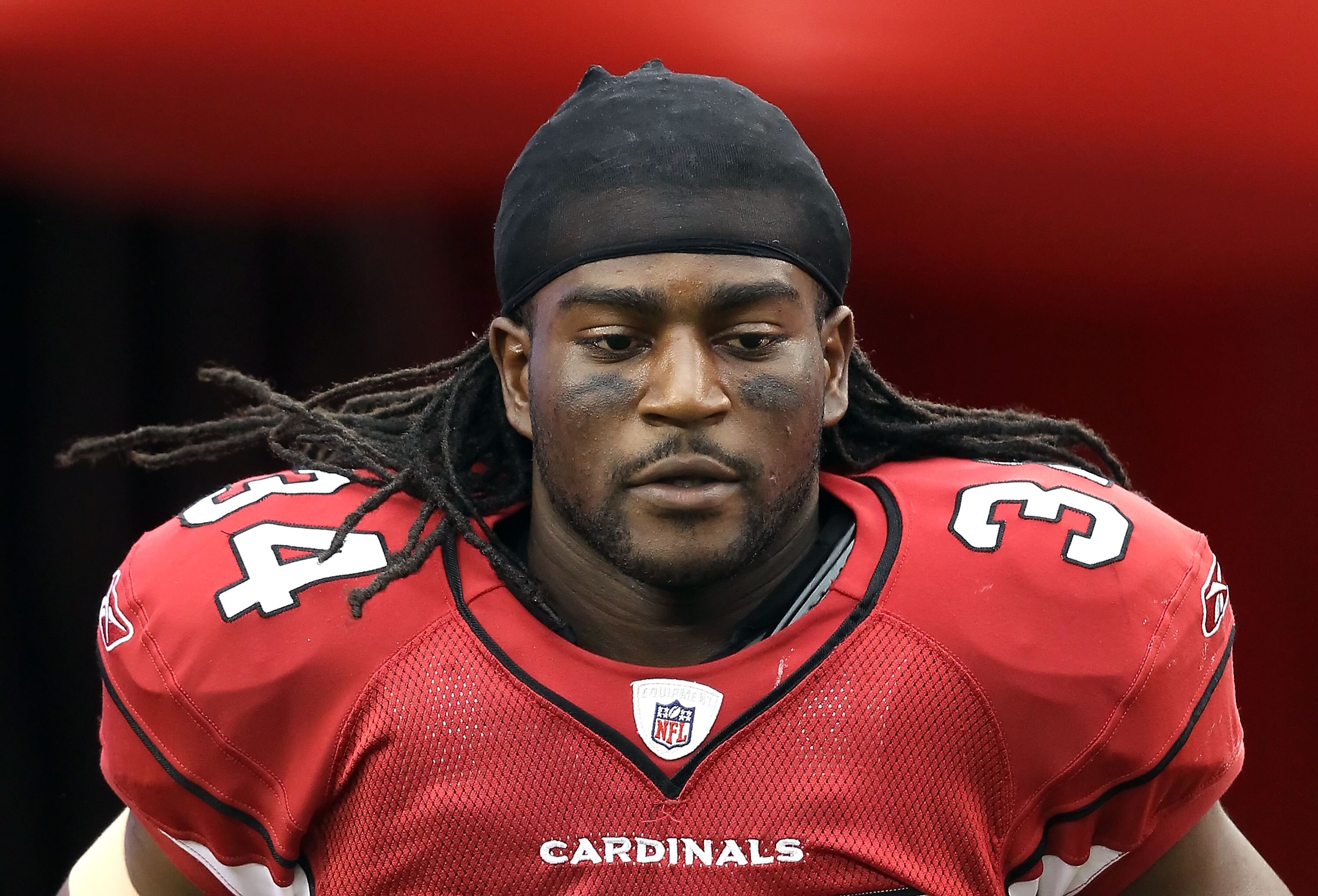 GLENDALE, AZ - OCTOBER 10:  Runningback Tim Hightower #34 of the Arizona Cardinals runs onto the field during introductions to the NFL game against the New Orleans Saints at the University of Phoenix Stadium on October 10, 2010 in Glendale, Arizona. The C