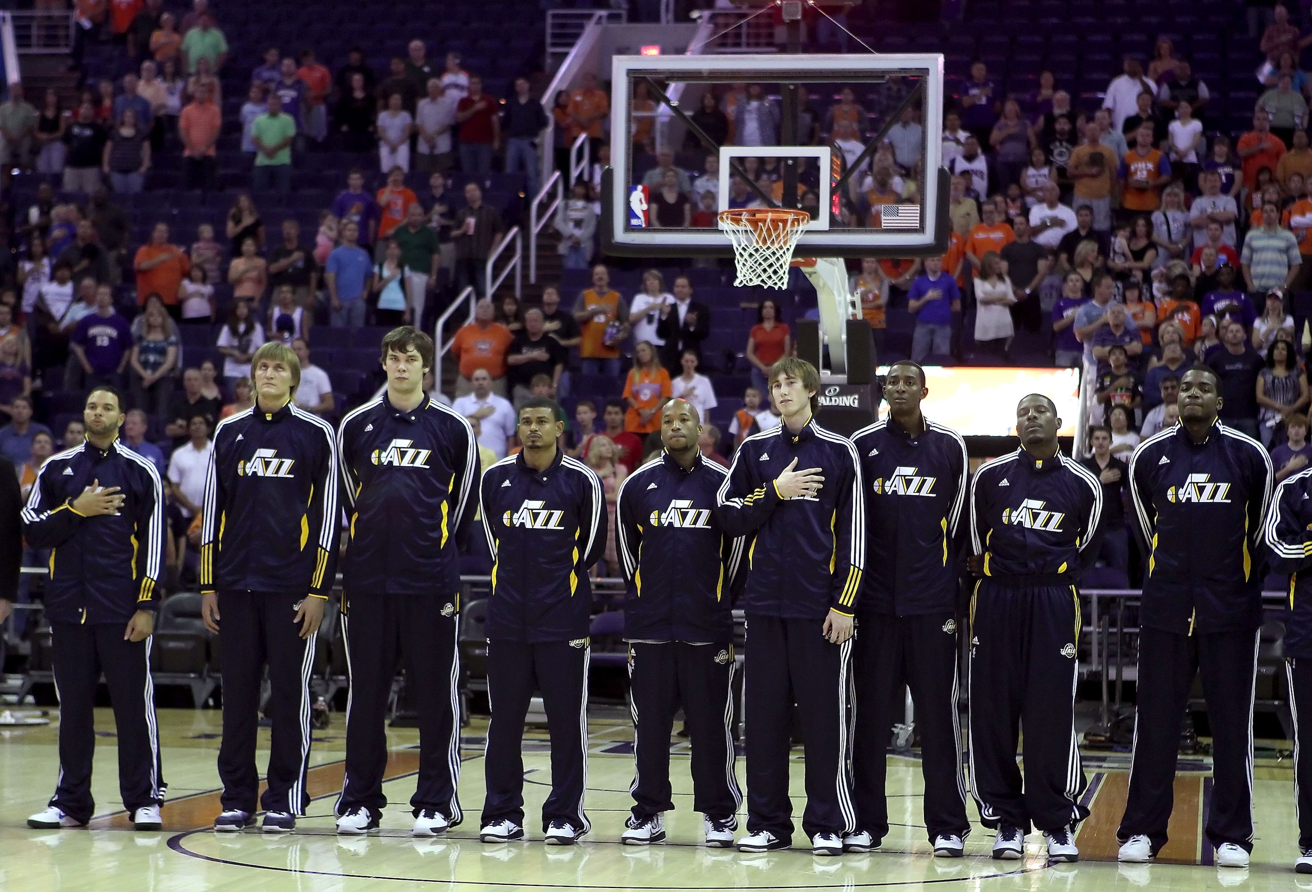 PHOENIX - OCTOBER 12:  The Utah Jazz stand attended for the National Anthem before the preseason NBA game against the Phoenix Suns at US Airways Center on October 12, 2010 in Phoenix, Arizona. NOTE TO USER: User expressly acknowledges and agrees that, by