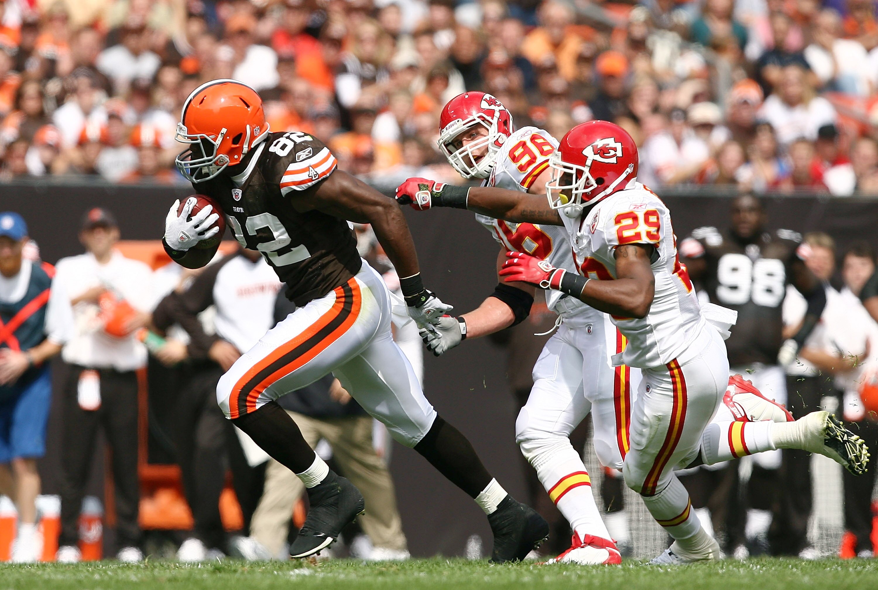 CLEVELAND - SEPTEMBER 19: Tight end Benjamin Watson #82 of the Cleveland Browns runs by defenders Anthony Toribio #98 and Eric Berry #29 of the Kansas City Chiefs at Cleveland Browns Stadium on September 19, 2010 in Cleveland, Ohio.  (Photo by Matt Sulliv