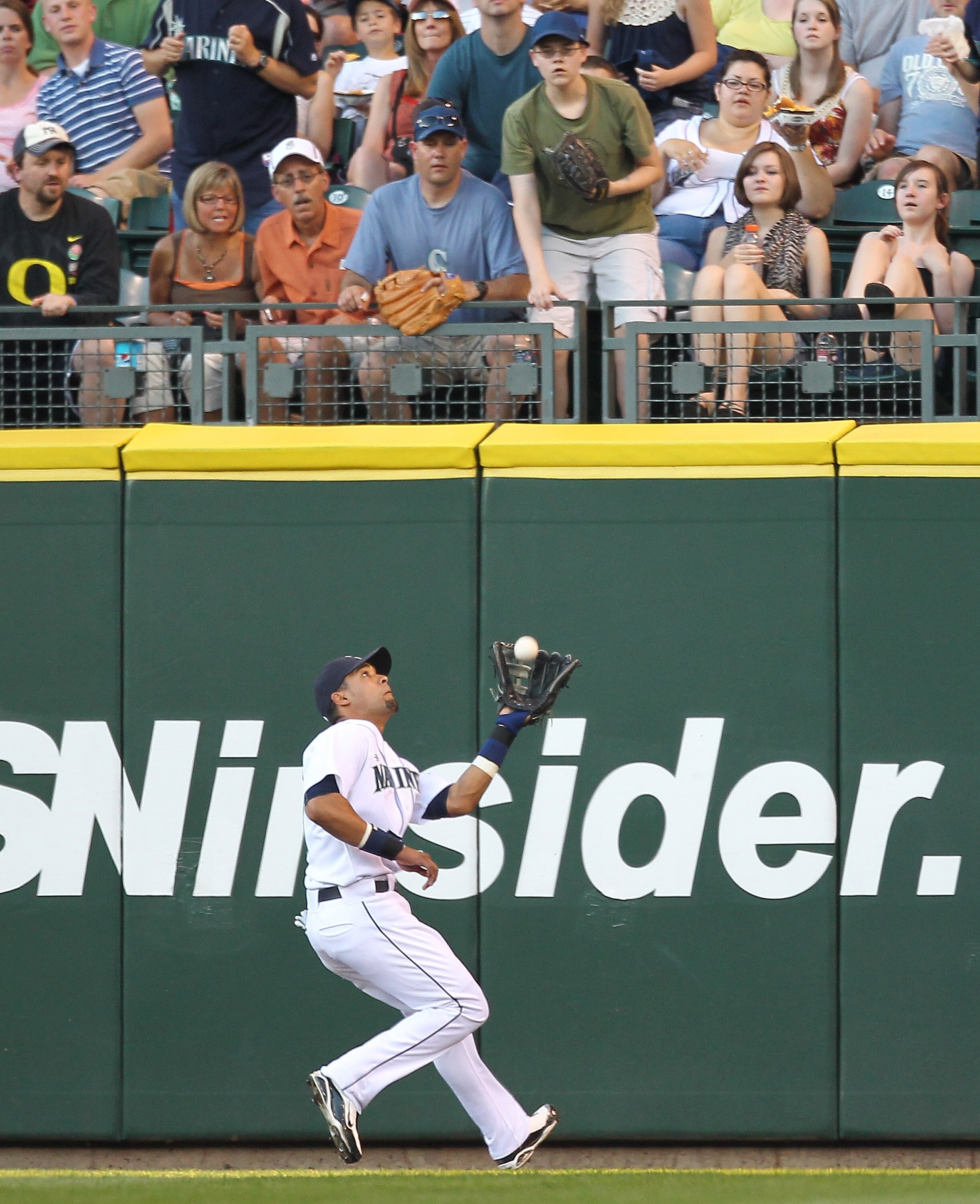 SEATTLE - JULY 08:  Center fielder Franklin Gutierrez #21 of the Seattle Mariners makes a running catch on a fly ball by Curtis Granderson of the New York Yankees at Safeco Field on July 8, 2010 in Seattle, Washington. (Photo by Otto Greule Jr/Getty Image