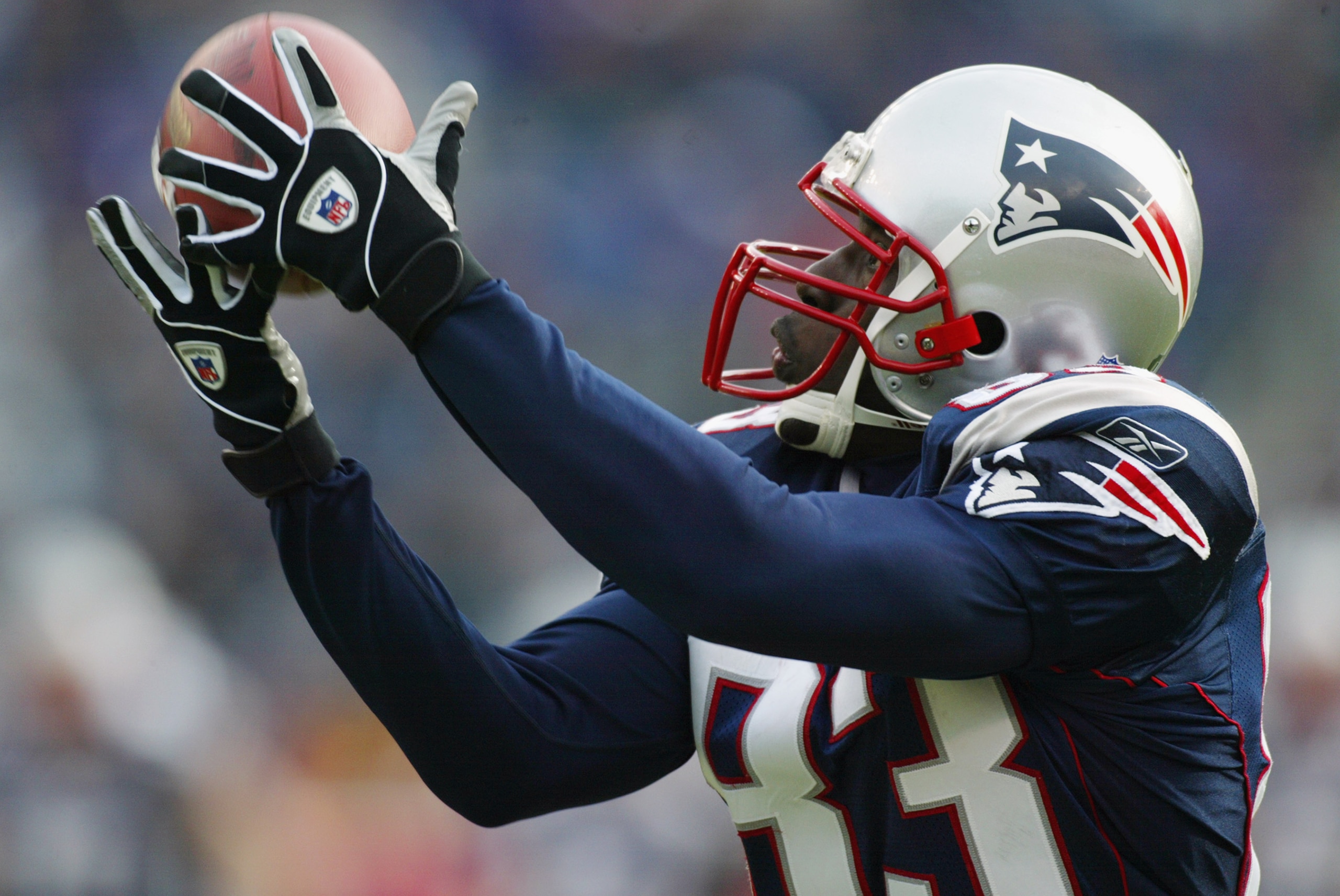 FOXBORO, MA - DECEMBER 8:  Deion Branch #83 of the New England Patriots catches a pass from Tom Brady against the Buffalo Bills during the NFL game on December 8, 2002 at Gillette Stadium in Foxboro, Massachusetts.  The Patriots defeated the Bills 27-17. 