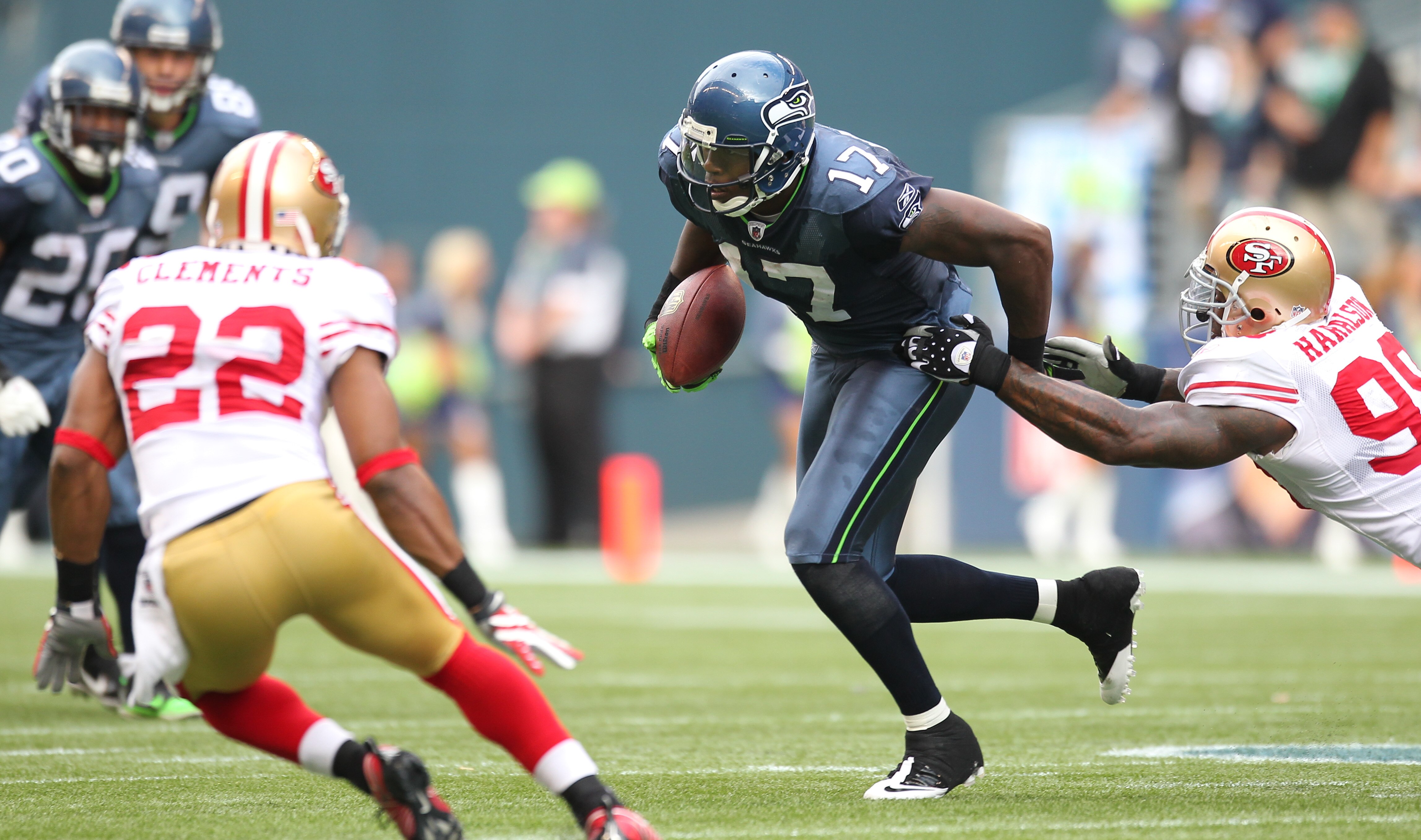 SEATTLE - SEPTEMBER 12:  Wide receiver Mike Williams #17 of the Seattle Seahawks rushes against Parys Haralson #98 of the San Francisco 49ers during the NFL season opener at Qwest Field on September 12, 2010 in Seattle, Washington. (Photo by Otto Greule J