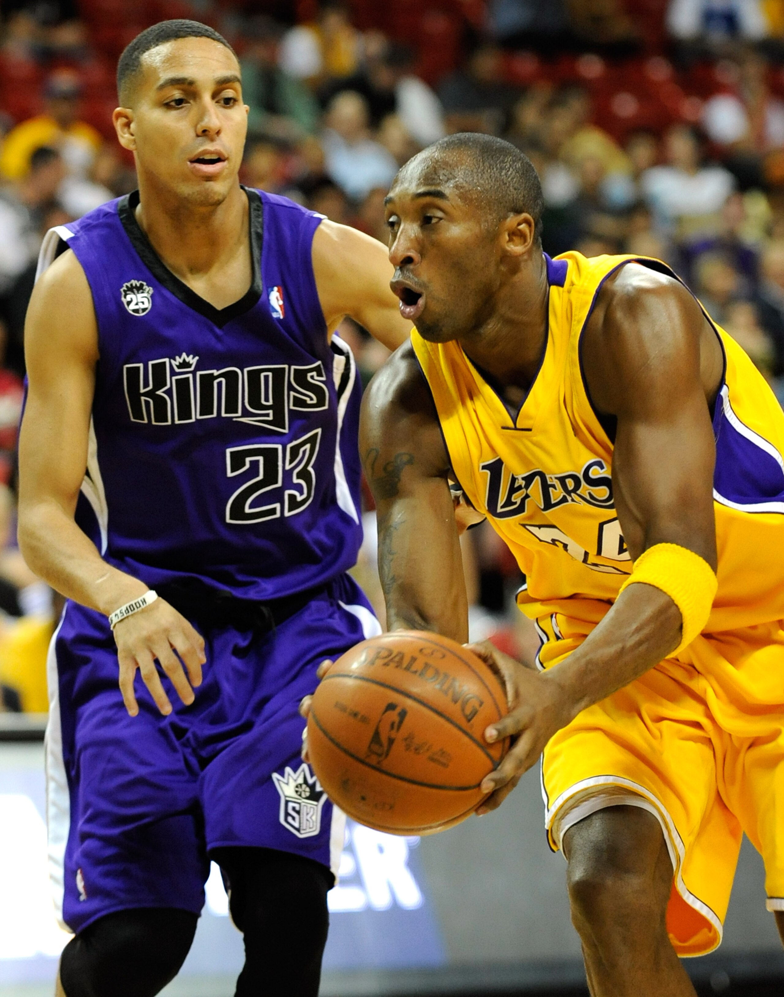 LAS VEGAS - OCTOBER 15:  Kobe Bryant #24 of the Los Angeles Lakers drives around Kevin Martin #23 of the Sacramento Kings during their preseason game at the Thomas & Mack Center October 15, 2009 in Las Vegas, Nevada. NOTE TO USER: User expressly acknowled