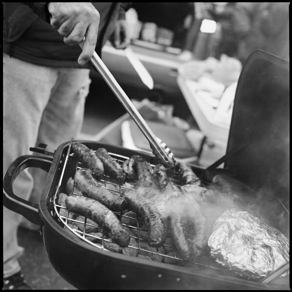 PHILADELPHIA - NOVEMBER 18: A tailgater cooks sausages prior to the start of the NFL game between the Miami Dolphins and the Philadelphia Eagles at Lincoln Financial Field on November 18, 2007 in Philadelphia, Pennsylvania. Born and bred into American spo