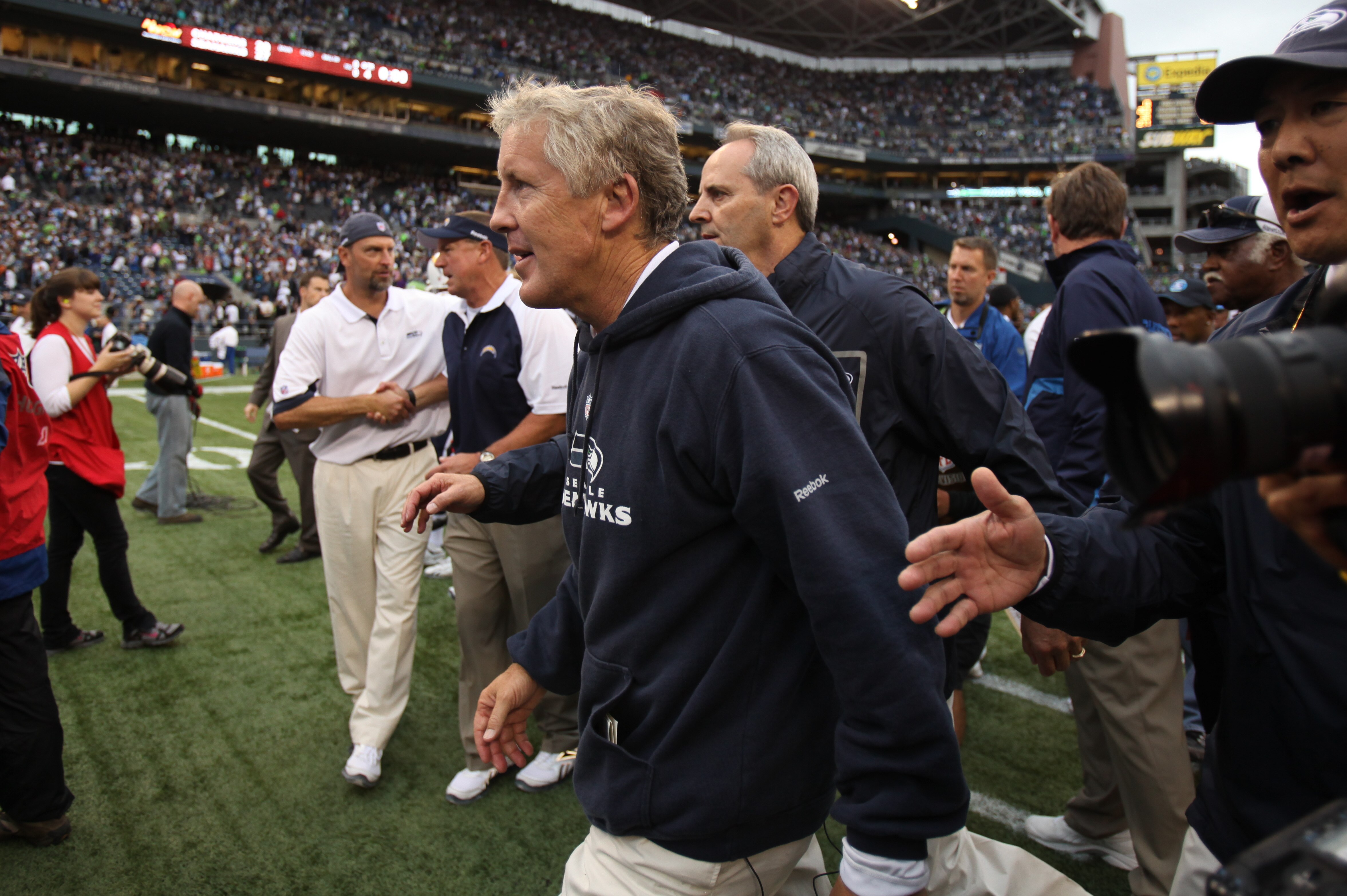 SEATTLE - SEPTEMBER 26:  Head coach Pete Carroll of the Seattle Seahawks heads off the field after defeating the San Diego Chargers 27-10 at Qwest Field on September 26, 2010 in Seattle, Washington. (Photo by Otto Greule Jr/Getty Images)