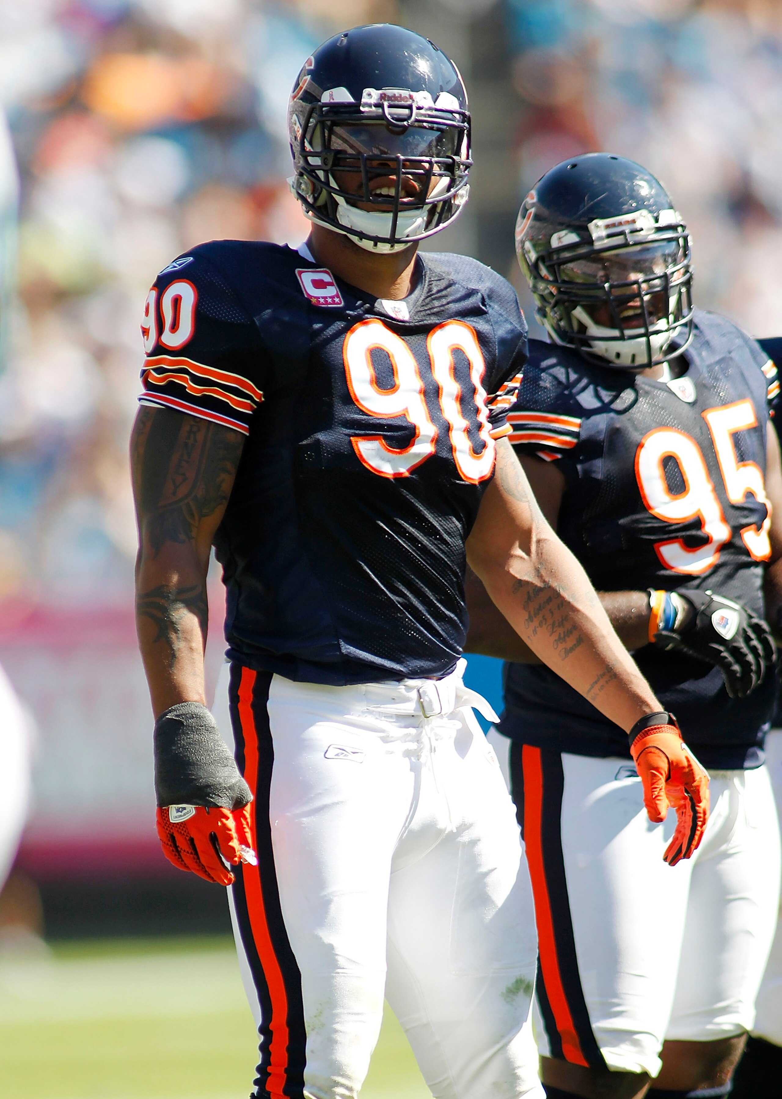 CHARLOTTE, NC - OCTOBER 10: Defensive end Julius Peppers #90 of the Chicago Bears stands on the field against the Carolina Panthers at Bank of America Stadium on October 10, 2010 in Charlotte, North Carolina. (Photo by Geoff Burke/Getty Images)