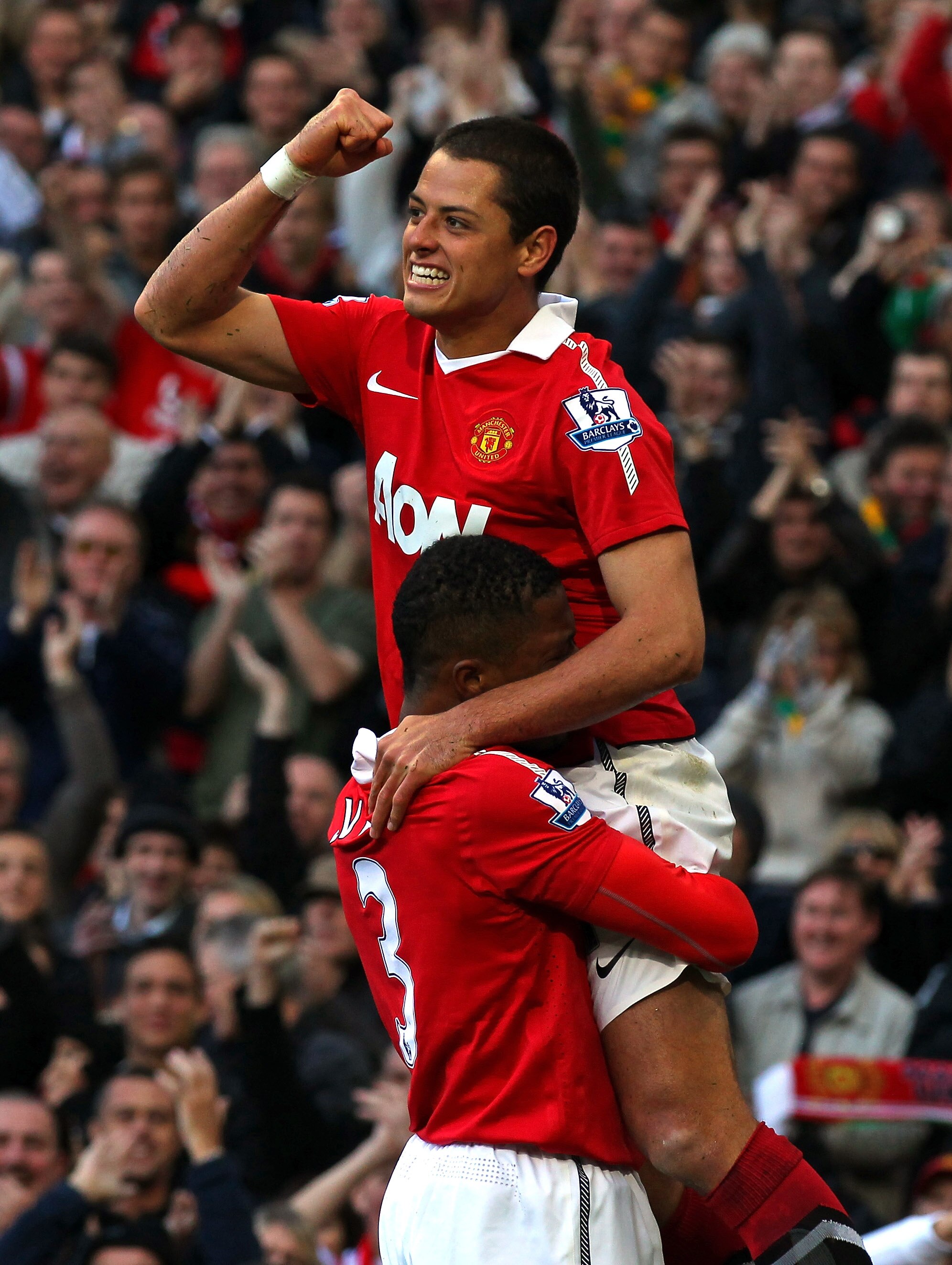 MANCHESTER, ENGLAND - OCTOBER 16:  Javier Hernandez of Manchester United celebrates with Patrice Evra after scoring the first goal during the Barclays Premier League match between Manchester United and West Bromwich Albion at Old Trafford on October 16, 2