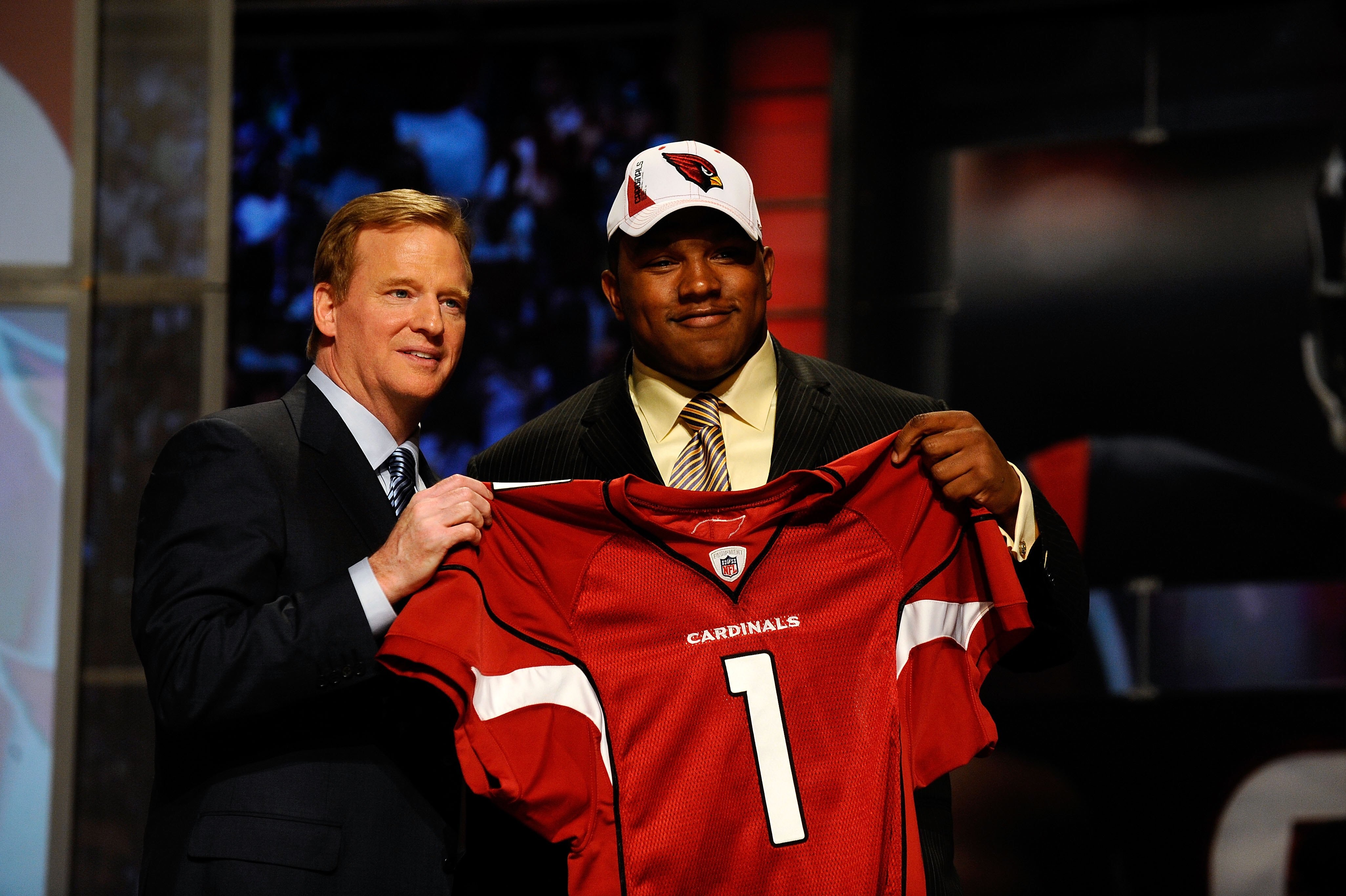 NEW YORK - APRIL 22:  Dan Williams from the Tennessee Volunteers poses with NFL Commissioner Roger Goodell as they hold up a Arizona Cardinals jersey after Williams was selected number 26 overall by the Cardinals during the first round of the 2010 NFL Dra